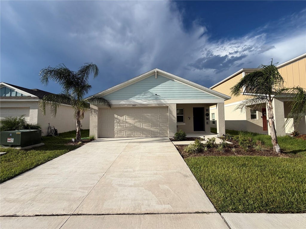 Photo of 1563 Ellesmere Avenue, Haines City, FL 33844 (MLS # O6443685)