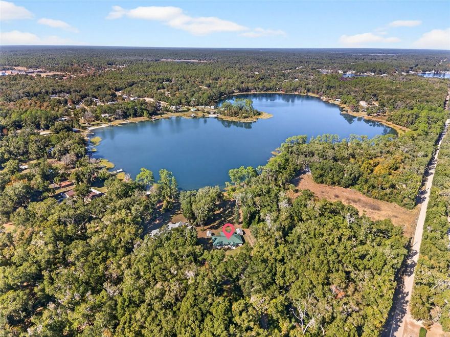 LAKE LIFE LIVING ON 75 ACRE MIRROR LAKE!! PRIVATE WATERFRONT,  3.21 ACRE PROPERTY READY FOR YOU TO PUT YOUR DOCK IN, PROP YOUR FEET UP AND BRING YOUR FISHING POLE! THIS 2019 CUSTOM BUILD FEATURES FRONT PORCH LEADING  TO SPACIOUS OPEN FLOOR PLAN WITH HUGE LIVING ROOM OVERLOOKING BOTH KITCHEN AND DINING ROOM AS WELL AS UNDER AIR FLORIDA ROOM WITH VIEWS OF MIRROR LAKE!! KITCHEN HAS BEAUTIFUL QUARTZ COUNTERTOPS, STAINLESS STEEL APPLIANCES(BARELY USED) AND AN ISLAND WITH PENDANT LIGHTING. OVERSIZED DINING AREA EXTENDS TO FRECH DOORS TO FLORIDA ROOM FOR ADDITIONAL RELAX AND ENJOY MOMENTS. THIS SPLIT BEDROOM PLAN OFFERS PRIVATE PRIMARY BEDROOM UPFRONT WITH PRIMARY BATH FEATURING GARDEN TUB, TILE SURROUND WITH GLASS AND GLASS DOOR SHOWER, SPACIOUS VANITY AND WALK IN CLOSET. ACROSS THE HOME ARE THE ADDITIONAL 2 ROOMY BEDROOMS SHARING 2ND BATH WITH QUARTZ VANITY AND TUB/SHOWER TILE SURROUND. STEPPING OUTSIDE TO PEACEFUL LAKE LIFE THE BACKYARD LEADS TO 94 FEET OF WATERFRONT LIVING!! BRING THE FISHING KAYAK AND ALL OTHER TOYS AND ENJOY LAKE LIFE! ONLY 45 MINUTES TO THE ATLANTIC OCEAN.