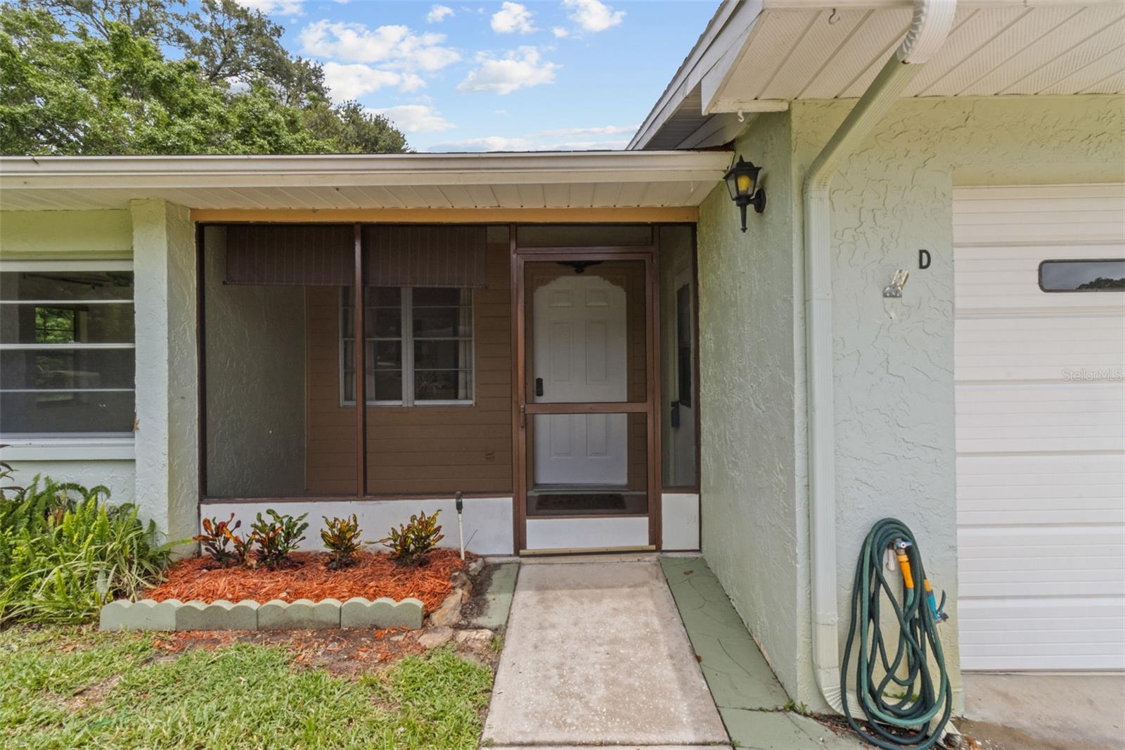 One or more photo(s) has been virtually staged. Come live in the heart of Palm Harbor in a lush 58 unit, age qualified community with a beautiful pool and clubhouse. Enjoy this renovated villa with new kittchen cabinets, granite counter tops, dishwasher and microwave as well as new vinyl floors from the kitchen into the dinning room. The primary en-suite bath has had a new shower installed July 2025. The house bath has had a new vanity, toilet and vinyl floors intstalled. The washer and dryer are newer and convey with the property. Water heater January 2018, AC installed June 2025.
Enjoy the sunset on the quaint screened in front porch that has just been re-screened. The property has a bonus 7.5'x12' attrium space situated between the living, dining, and garage. Perfect for al fresco dining or an herb garden.
The neighbor friendly community hosts activities in the club house which is adjacent to the community pool.
Monthly HOA/CONDO fees include Basic Cable (with 2 cable boxes, internet, The Silver Package which includes Paramount, Disney Plus and
Peacock), outside home pest control, termite control, trash, lawn maintenance, tree trimming, water, sewer, pool maintenance, roof repairs & replacement. Come see your new home!