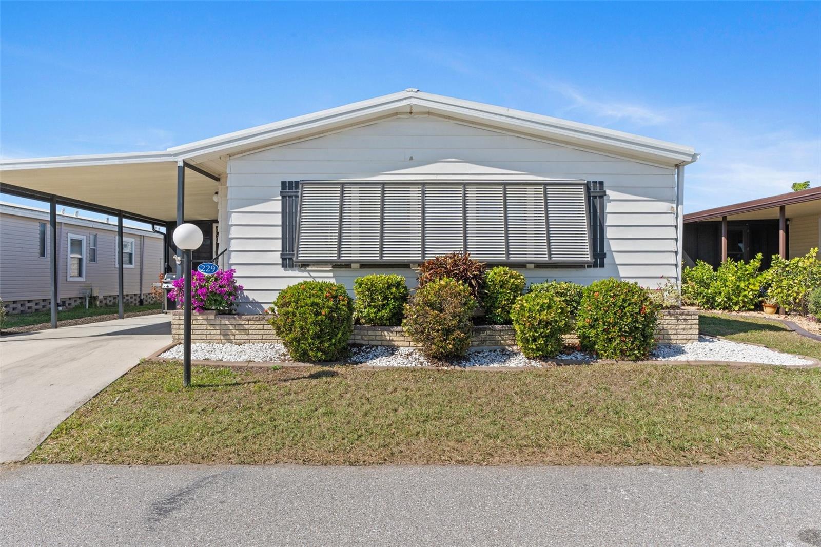 PRICE IMPROVEMENT! This home should be one of your top choices to view! Welcome to Lazy River Village! One of the premiere (if not THE best) 55+ waterfront manufactured park in all of Sarasota and Charlotte counties! The BEST amenities, clubs, and selection of activities you will find in any co-op park in all of Sarasota county and even Charlotte County. Lazy River is located on the banks of the beautiful Myakka River. This 2 bed 2 bath home is ready to move right in! This well-maintained home is the perfect seasonal place to enjoy Florida's coveted gorgeous winters and a perfect year-round home for those who love all 4 seasons of Florida. The spacious family room features cathedral ceilings and a wet bar--perfect for entertaining! There's also a convenient pass-through window from the kitchen to the family room. The cozy kitchen has everything you need to prepare home-cooked meals or more celebratory party fare! The bright office space offers plenty of room to work--work-from-home or use it for your favorite hobbies. A large screened patio is a fabulous space for enjoying Florida's coveted warm winter days, with extra large windows for a bright, vibrant living space. The laundry room has a washer, dryer, and sub-tub, along with shelving for storage.
This home has been well-kept and regularly maintained. The vapor barrier was replaced in 2018. New windows in the living room and front room. The metal roof and rain gutters were replaced in 2023. New water shut-off valve and backflow replaced in February 2025. Hot water heater replaced in 2023. Guest bathroom fully renovated in 2015. Ecobee smart thermostat installed in 2024, which has capability of monitoring the temp and energy usage in person or remotely.
If you enjoy an abundance of activities, you will have plenty to choose from in Lazy River Village: Pickleball, tennis, bike clubs, card clubs, and pontoon boating. They even have a professional woodworking shop. A low monthly fee of $276 includes all the amenities. There are other amenities for an extra fee, such as a marina slip if your home is not located on the water.
One of the things that makes Lazy River Village so great is its proximity to...well...everything! Be prepared to enjoy Florida's wildlife at its finest, both inside the Lazy River Village complex and at abundant state parks and nature preserves. Shopping and dining surround you in all directions. The spring training homes of both the Atlanta Braves & the Tampa Bay Rays are just a minutes away. The world-renowned Gulf of Mexico beaches are all within 30 minutes or less! 1) Englewood beach, 2) Casperson Beach (GREAT for shelling), 3) Venice Beach (shark tooth capital of the world), 4) Brohard Paw Park, 5) Nokomis beach (you've GOT to experience the weekly drum circles), 6) the island gem of southwest Florida: Boca Grande... And finally: 7) Siesta Key in Sarasota has been ranked multiple times as the number one beach in the nation and is a mere 35 minutes away. Lazy River Village offers a lifestyle that every retiree dreams of. You have the quaint downtowns of Venice and Punta Gorda--both cities are often ranked as Top 10 destinations in the country for retirement. Another local favorite, Englewood, is a cozy, fun beach town on the Gulf of Mexico.
The residents of Lazy River Village agree: Lazy River is a community that offers it all. Don't miss your chance to see this home!