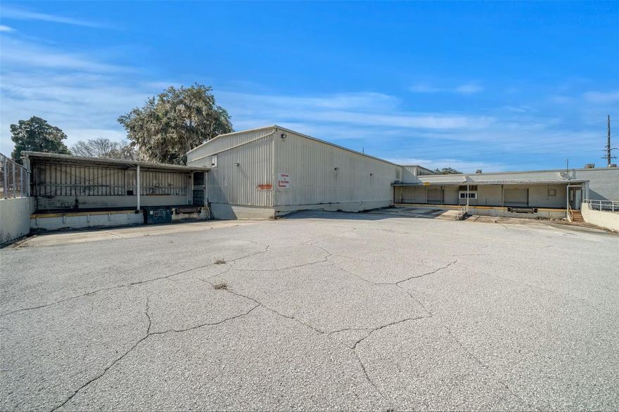 This 1.34-acre property features a 30,120± SF industrial and commercial building located in Ocala. This sprinkled, single-story facility offers clear ceilings ranging from 14.5' to 22.5'. Built for straightforward logistics and daily operations, the site is equipped with seven loading docks making it well-suited for standard distribution, service, or storage needs. Situated on a corner lot just two blocks from a city public parking lot, the property falls within an Opportunity Zone with flexible FBC zoning, allowing for a variety of commercial uses. A large portion of the building is air conditioned, providing for office space opportunity. Positioned just southeast of Downtown Ocala, it is near the Marion County Courthouse and AdventHealth, providing direct access to US-301/441 and practical routing to Interstate 75 via SR 40. Inquire today!