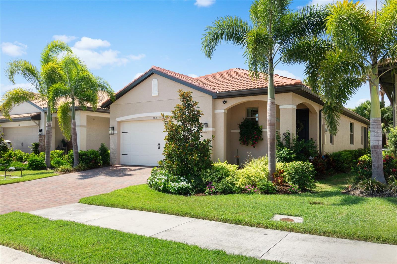 Some homes you walk through and forget. This one stays with you.
From the moment you step inside, there’s the unmistakable feeling of home. Light dancing across the wood look tile floors, the soft sophistication of crown molding and designer lighting, the way every room feels both beautiful and easy to live in.
Tucked at the edge of Toscana Isles on one of the deepest lots in the neighborhood, this is more than an address, it’s a place to breathe again…a sanctuary and landing place. No neighbors behind you, only open sky, a privacy fence, and plenty of room for your family to throw a frisbee or kick a ball.
Inside, you’ll find
• Over $60,000 in custom upgrades
• Professionally decorated interiors with a timeless, coastal-inspired style
• Plantation shutters throughout
• A kitchen with granite counters, a walk-in pantry, and space to gather
• A spacious primary suite with a generous walk-in closet and calming ensuite bath
• A versatile third bedroom, currently a sun-filled home office with French doors and full closet — perfect for guests, creative work, or retreat
This is a home where there is nothing to do but move in and begin living.
And the lifestyle…
Morning coffee on the lanai while the breeze moves through the palms. Afternoons fishing or kayaking on the stocked community lakes. Evenings at the infinity-edge pool, a round of pickleball with friends, or a quiet golf cart ride through streets lined with neighbors who wave and stop to talk.
Toscana Isles is a gated, resort-style community offering tennis, bocce, a fitness center, dog park, playground, and a calendar of events that make it easy to connect.
Step inside and see if it feels like yours.