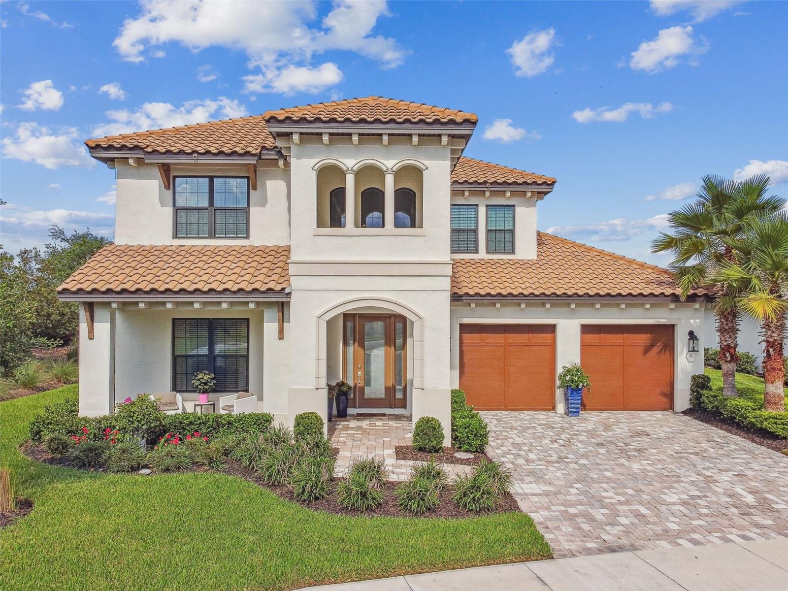 Welcome to your dream home in the exclusive gated community of River's Edge! This stunning home boasts 5 spacious bedrooms, 4 full baths, and a 3-car garage, giving you plenty of room to live, work, and play. With 3686 square feet of living space on an oversized lot, you'll have all the space you need. As you step through the front door, you'll be greeted by a guest bedroom off the foyer - perfect for overnight guests or as a private office. And when it's time to do laundry, you'll love the convenience of the door from the master bedroom closet to the laundry room. The gourmet kitchen truly is a chef's dream, with a walk-in pantry and plenty of counter space for meal prep. And when it's time to entertain, the open concept design allows for seamless flow between the kitchen, dining area, and great room. The first-floor owner's suite is a true retreat, featuring large dual walk-in closets, vanities, and a luxurious stand-alone bathtub. Upstairs, you'll find three additional bedrooms, two full bathrooms, and a game room - perfect for kids, guests, or as a home theater. Tray ceilings and a Mediterranean elevation add to the home's charm, while the gas line at the lanai, water softener pre-plumb, and laundry sink pre-plumb offer added convenience. Located near Wiregrass Mall, Tampa Premium Outlets, restaurants, and I-75, this home is perfectly situated for your every need. Click the link to take a virtual tour or schedule a private showing today!