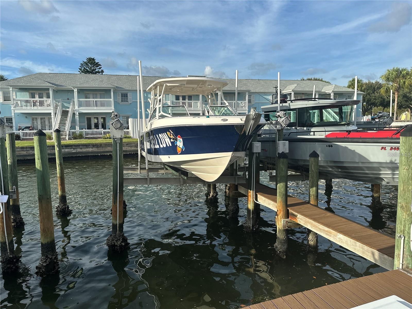 Waterside to Coquina Key South! Boat Slip 11SS. This prime slip comes complete with a 13,000 lb lift, ideally suited for boats up to 32 ft in length. Offering direct access to the expansive blue waters of Tampa Bay and beyond to the iconic Skyway Bridge, this location is a boater's dream. Maintenance of this dock slip is expertly handled by the Homeowners Association (HOA), ensuring your convenience. The slip is thoughtfully equipped with water and electric connections, as well as a secure storage dry dock box. Ownership within Waterside at Coquina Key, whether on the North or South side, is a prerequisite. Condo is available for sale in Waterside as well, please see separate listing.