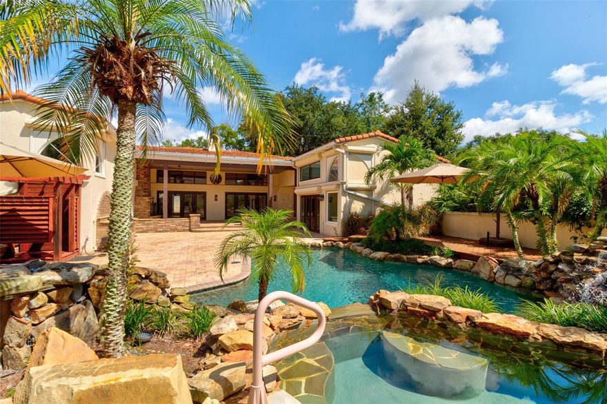 Sumptuous aviation-themed residence in the world’s most prestigious fly-in community.  Formerly owned by Bill Lear, Jr. of Lear Jet fame, this prime residence was built in 1990 and totally renovated from 2011-2018.  (Motivated Sellers have recently reduced price by over $200,000 which is priced well below replacement cost.) The sprawling 5-bedroom 3.5 bath home and its climate-controlled 50X40x14 hangar lie at the end of a private taxiway on nearly an acre of manicured grounds.  Perfectly suited for indoor and outdoor entertaining, the home opens to a spectacular resort-style lanai with a solar-heated pool, spa, waterfalls, and a covered patio with gas fireplace.  The charming Great Room with high ceilings, crown molding, and stone Mediterranean arches is ideal for elegant indoor entertaining.  A state-of-the-art kitchen features custom granite counters, large center island, and voluminous cabinet space.  The handsome English-style library serves equally well as an office, pub, or billiard room.  The luxurious Master Suite has 14’ ceilings, a spacious walk-in closet, a plush shower and free-standing tub.  Included in the home’s amenities are whole house hurricane shutters, a solar/electric oversize hot water tank, central vac system, a 500-gal. underground propane tank, generator-ready concrete pad with transfer switch. Situated in a prime location in an upscale guard-gated community, this residence has immediate access to Spruce Creek’s 4,000’ lighted runway, GPS approach, and convenient fuel and maintenance services. Spruce Creek Country Club Membership opportunities are available for golf, tennis, pickleball,  fitness center, pool, restaurants & lounge.  The famous Spruce Creek Fly-In offers the best of all worlds—shopping, restaurants, health care, good schools, Embry Riddle Aeronautical University and close access to the world’s most famous beach. ;Water: City