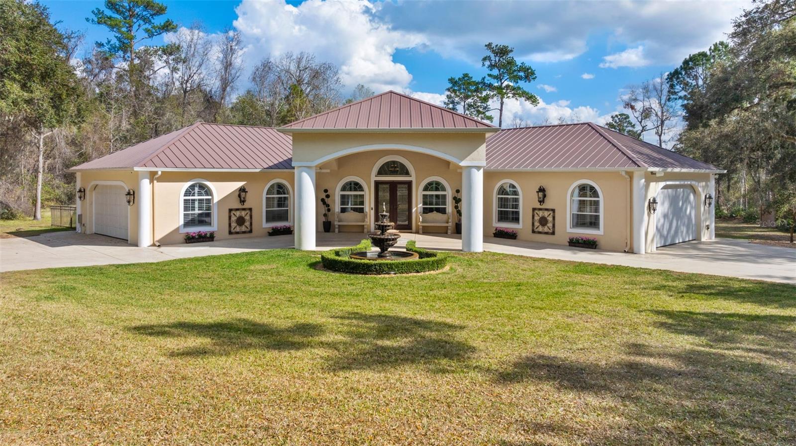 Welcome to your dream estate! Nestled on a sprawling 7.1-acre lot, this magnificent property offers unparalleled privacy and luxury. Enter through the closed circuit gated entrance and follow the circular drive to the elegant portico.
The estate features a serene spring-fed pond with "resident swans" and trails throughout the woods, perfect for nature lovers. With 5105 sq. ft. of living space, the open floor plan seamlessly integrates the living, dining, and billiard areas, creating an ideal setting for entertaining.
The beautiful kitchen is a chef's delight, boasting a gas range and abundant cabinetry. The two-room primary suite includes a luxurious bath. The versatile guest suite doubles as a studio, equipped with a Murphy bed, kitchenette, and dressing room, offering a private entrance for added convenience.
For your peace of mind, the home and property are equipped with hardwired security cameras. The oversized two-car garage includes a charging station, storage cabinets, and space for a golf cart. Plus, you'll never lose power with the whole house Generac generator.
This estate is a rare find, combining luxury, privacy, and modern amenities in a picturesque setting. Don't miss the opportunity to make it yours!