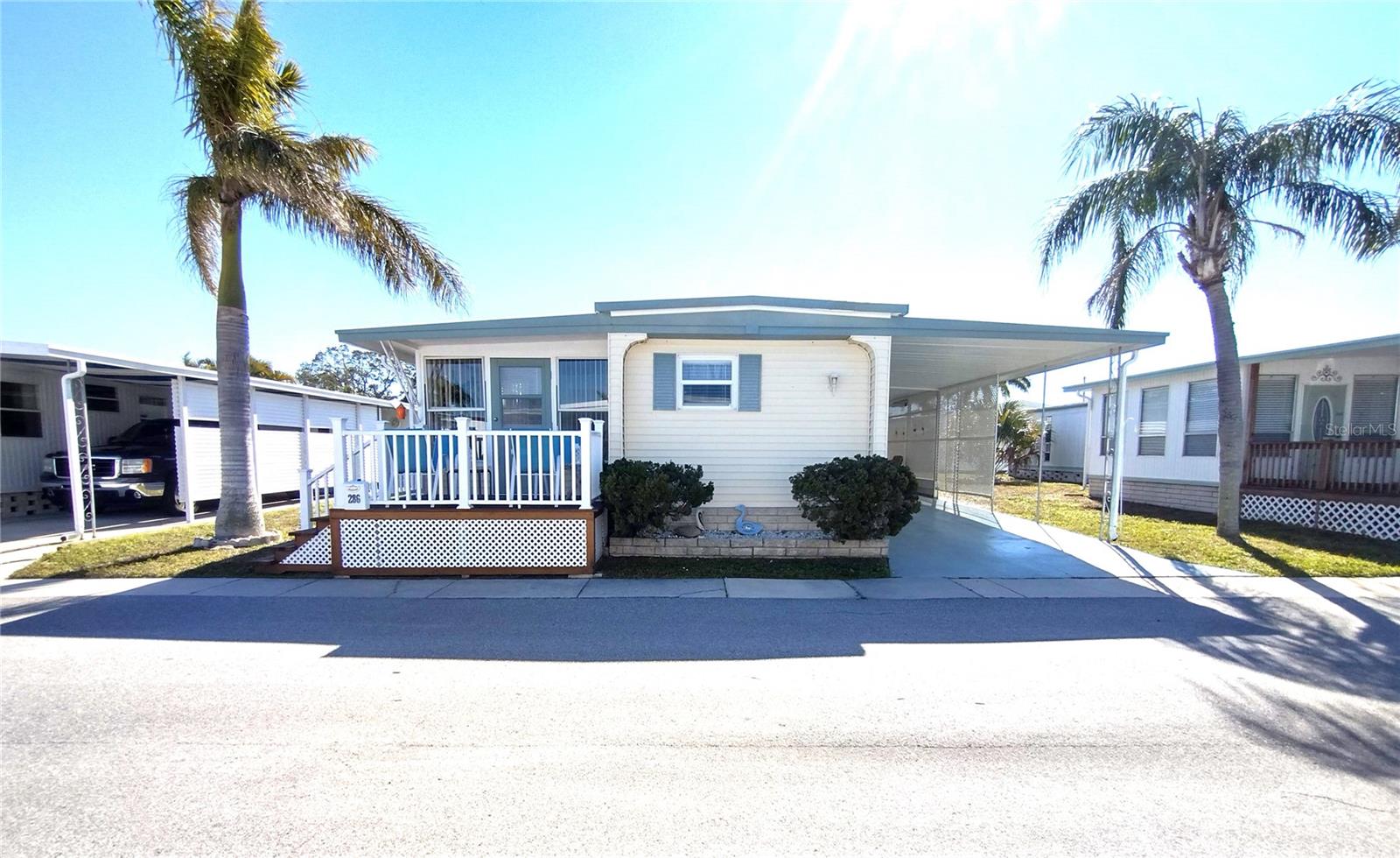 Back on the market at no fault of seller. PRICE IMPROVEMENT FOR THIS COMPLETELY UPDATED TURN-KEY HOME WITH NEW WINDOWS AND AC UNIT!! It has 2 bedrooms and 1 full bathroom and is being sold fully furnished. There are beamed ceilings and newer laminate flooring throughout the home. All windows and blinds were replaced in 2019. Brand new AC was installed in 2022, and the home has been renovated with drywall throughout. All appliances, furniture, TVs, linens and kitchenware are included. All you have to do is unpack and relax. The low monthly maintenance fee of $210 makes your dream of Florida living affordable. The front entrance of this home has a custom-built walk-up deck to the front porch. The front door opens into the bright and airy Florida room. The Florida room, which was updated in 2024, offers seating for entertaining guests and there is a drop leaf table where you can enjoy your morning coffee in peace and tranquility. Upon entering this meticulously kept beautiful home from the Florida room, you will find yourself thinking you just stepped into the pages of a home décor magazine. The custom step-up IKEA kitchen offers ample storage and boasts a pull-out pantry as well as a pull out lazy susan in the corner. The kitchen is large enough to accommodate the dining table with plenty of room to spare. The spacious living room offers a cathedral beamed ceiling. This home is tastefully decorated in a Florida coastal theme. The living room sofa offers a pull-out queen bed for more overnight guest space. Windows surround this beautiful home so there is no lack of sunshine here!! Down the hallway you will find the guest bedroom that is roomy enough for a bed and has a custom-built closet space. The spacious bathroom is tastefully done with plenty of vanity space. It has a corner glass shower surround as well as custom built storage areas and shelves for your towels, laundry hamper and much more. The master bedroom is the whole back of the house. It offers a mirrored closet space as well as built-in drawers. Conveniently located across from the bathroom is a door to access the carport, storage shed and laundry area. Behind the shed there is a patio area for all of your BBQs or just sitting and enjoying the sunshine. The covered carport offers outdoor seating space and can accommodate 2 cars and a golf cart. Golden Gate is a highly sought after 55+ resident owned community with private maintained roads which offers many amenities to its residents. There are men’s and women’s clubs, shuffleboard, horseshoe pit, bocce ball court, heated pool and spa, social activities, planned outings, movie nights, and so much more. The community is located close to a Walmart Super Store, or you could take your golf cart. The store has designated golf cart parking! For the golf enthusiast there is the Mainlands Gulf Club just a signal light away. It is a public 18-hole Florida links style course. There are numerous stores and restaurants within a minute's drive away and is close to major airports and interstates. Best of all it is 15 minutes from the award-winning Florida Gulf Beaches. The listing price includes the cost of the landshare which is valued at $45,000. Pet friendly with 1 pet allowed up to 20 pounds. Buyer to verify all measurements and restrictions and rules of the community.
