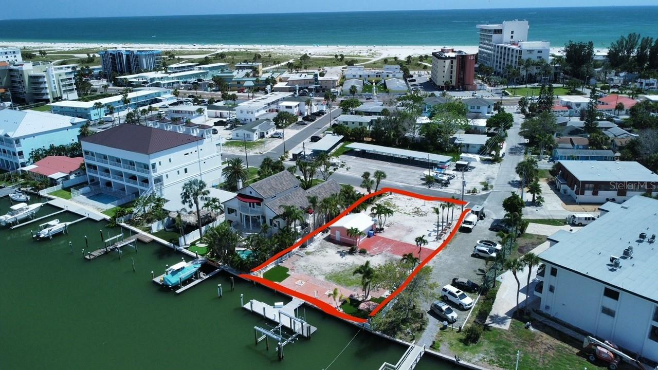 Very rare opportunity…... This property is an excellent investment possibility or the perfect location for your future dream home! This amazing waterfront property is located just over one block from the gorgeous wide sandy beaches on the Gulf and only 8 blocks to world famous John’s Pass! This lot boasts approximately 80 feet of protected water frontage on nearly 10,000 square feet of land. There is also a large dock with a 24,000lb boat lift and an additional wet slip.
For those interested in an unparalleled investment opportunity, this property is zoned RFM-30. This unrestricted zoning permits a multi-family structure of up to 4 units, with an approved variance. As an added bonus, this zoning also permits short term/tourist rental use with “no change of occupancy restrictions”. There’s more – RFM-30 also permits hotel/motel use, which would allow for a quant boutique property of up to 7 motel units, with an approved variance.
This huge lot could also be the perfect space to build your own waterfront dream home. This is a boater’s delight with protected deep water and a very short run out to the Gulf through world famous John’s Pass.
The options are endless on this rare property. This is one of only two waterfront lots currently available on Treasure Island with RFM-30 zoning and a short walk to the beach! While the previous single-family home has already been meticulously removed, there is a garage remaining, as well as driveway and patios. This allows you to park your boat at the large dock with lift and immediately begin enjoying your new waterfront oasis while you design your dream home or investment opportunity! This property is priced to sell and won’t last long!