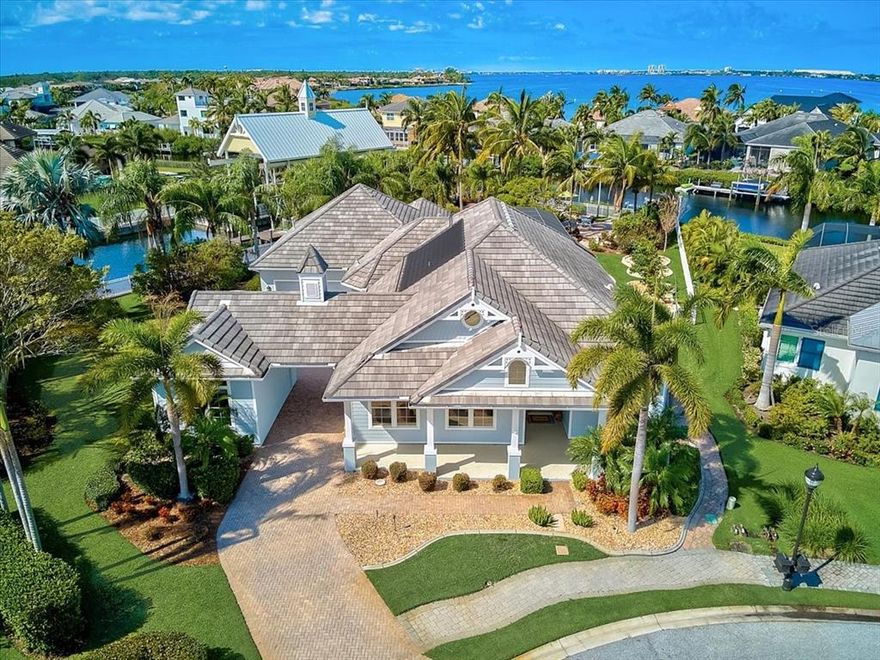 $250,000 price reduction. Luxury Waterfront Living in one of the areas most sought after boating communities; Harbour Walk in the Inlets.  This custom Arthur Rutenberg built home is perfectly positioned on a 1/2 an acre with nearly 300 feet of water frontage; on both fresh and salt water canals.  Extensive outdoor living including a huge patio, dock and 12,000lb lift.  Access the Manatee River by boat in just minutes; and then beyond to the Intracoastal Waterway, Tampa Bay and the Gulf of Mexico.  Nearly 3,500 square feet of living area with 4 bedrooms, 3 full and 1 half bath and a bonus room located off the back of the house (perfect for a workshop or tack room; currently used as an office).  Fantastic screened patio/pool space with spa, outdoor kitchen, outdoor shower and pool path.  Gourmet kitchen with a Viking natural gas cooktop, SubZero refrigerator, solid cabinets and granite countertops. Primary suite is a retreat offering double walk-in closets and a spacious bath with dual vanities, soaking tub and walk-through shower.  Lovely guest suites and guest baths. High ceilings and plenty of closets and storage space. The back and side yard have been completely fenced so you can let your dogs run and play.  Located within close proximity to all amenities including the new Costco shopping center, I75 for easy travel to Sarasota or St.Pete/Tampa. Room Feature: Linen Closet In Bath (Primary Bedroom).