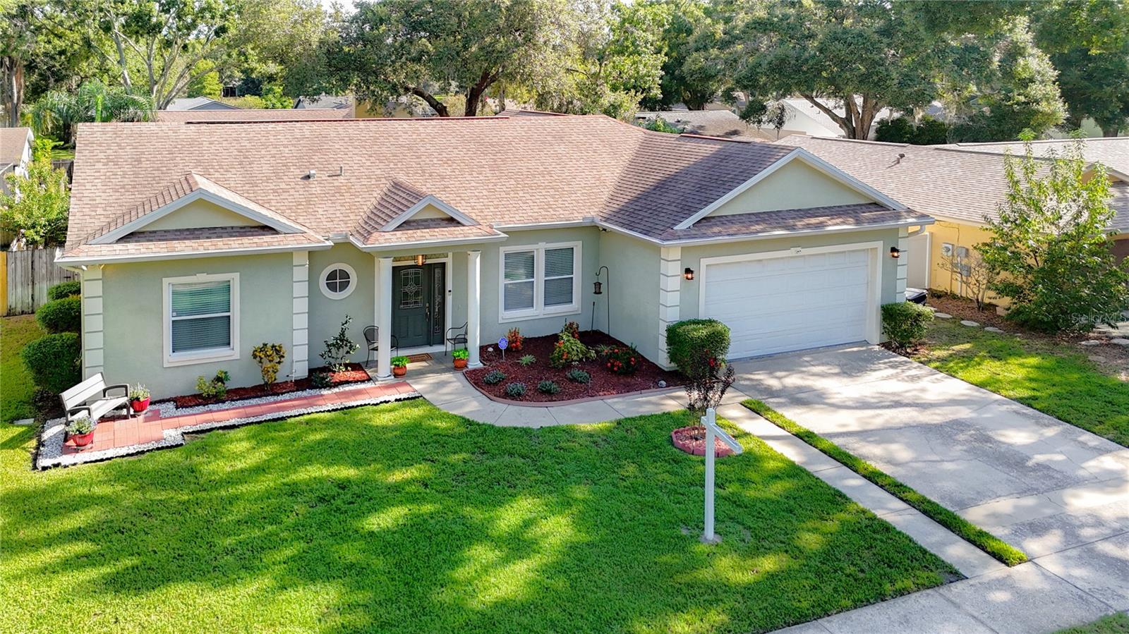 OFFERED BELOW PROFESSIONAL APPRAISAL VALUE, THIS 2009 BUILT CONCRETE BLOCK POOL HOME is UPDATED and WELL-MAINTAINED, offering nearly 1,800 SF of beautifully designed living space in the desirable DEED-RESTRICTED MANDARIN LAKES neighborhood—with NO CDD FEES OR FLOOD INSURANCE REQUIRED.
Enjoy a SINGLE-STORY, SPLIT-FLOOR-PLAN layout (NO STEPS!) and a FULLY FENCED BACKYARD—perfect for privacy, pets, or play. Step inside through a DECORATIVE GLASS FRONT DOOR into the formal living and family room, with OVERSIZED BEDROOMS, TILE FLOORS in wet areas, and BRAND-NEW VINYL PLANK FLOORING throughout—NO CARPET ANYWHERE. Freshly painted, with energy-efficient DUAL-PANE WINDOWS, UPGRADED LIGHT FIXTURES, and CEILING FANS throughout.
The LARGE, SPACIOUS KITCHEN features GRANITE COUNTERTOPS, SOFT-CLOSE CABINETRY WITH PLENTY OF DRAWERS, and a BUILT-IN WINE RACK. BOTTOM CABINETS OFFER PULL-OUT SHELVES AND LAZY SUSANS. STAINLESS-STEEL DOUBLE SINKS pair with NEWLY REPLACED, TOP-OF-THE-LINE APPLIANCES in a FINGERPRINT-RESISTANT FINISH. Completing the kitchen are a PANTRY, EAT-IN COUNTER, and a BEAUTIFUL, LARGE CEILING FAN for cooler cooking.
The DINING ROOM offers functionality and seamless flow from the kitchen to the OVERSIZED BEDROOMS.
Retreat to the SPACIOUS PRIMARY SUITE, featuring a LARGE BATHROOM with DOUBLE GRANITE SINKS, an OVERSIZED FRAMELESS RAIN SHOWER, CUSTOM SOAKING TUB, DISPLAY AREA, and LINEN CLOSET. The OVERSIZED BEDROOM includes a TRAY CEILING and WALK-IN CLOSET.
Enjoy FLORIDA LIVING by stepping out of either SLIDING DOOR onto a LARGE COVERED PATIO with a NEW ROOF and FRESHLY PAINTED COOL DECK. Relax in the LARGE 30’ X 15’ GAMING POOL (perfect for water volleyball) with ROMAN STEPS on each end and a HANDRAIL on one. A COLLAPSIBLE CHILD-SAFETY FENCE and full POOL EQUIPMENT PACKAGE, including a NEW POOL VACUUM, are included.
Additional features include: WASHER & DRYER, WHOLE-HOUSE WATER FILTRATION SYSTEM, COLD CENTRAL AC HEAT PUMP, 2-CAR GARAGE WITH CUSTOM SHELVING, DROP-DOWN STAIRS TO A FINISHED ATTIC, AUTOMATIC GARAGE DOOR OPENER, SECURITY SYSTEM, WHOLE-HOUSE EMERGENCY GENERATOR SYSTEM, CUSTOM HURRICANE PANELS, and LEAF-FILTER GUARDED GUTTERS.
Peace-of-mind bonus: HOME INSPECTION AND PROFESSIONAL APPRAISAL are complete—REPORTS AVAILABLE. Includes a 12-MONTH WHOLE-HOUSE WARRANTY and a BUYBACK GUARANTEE if anything was missed during the seller’s inspection.
Outstanding LOCATION near CITRUS PARK MALL, TWO ERs, the VETERANS EXPRESSWAY, and TAMPA INTERNATIONAL AIRPORT. SEVEN SCHOOLS are within two miles, and it’s just 10 miles from USF.
If you’re seeking a MOVE-IN-READY, UPGRADED HOME with every major item already handled, don’t miss 5825 Bitter Orange Ave—schedule your showing today before it’s gone!