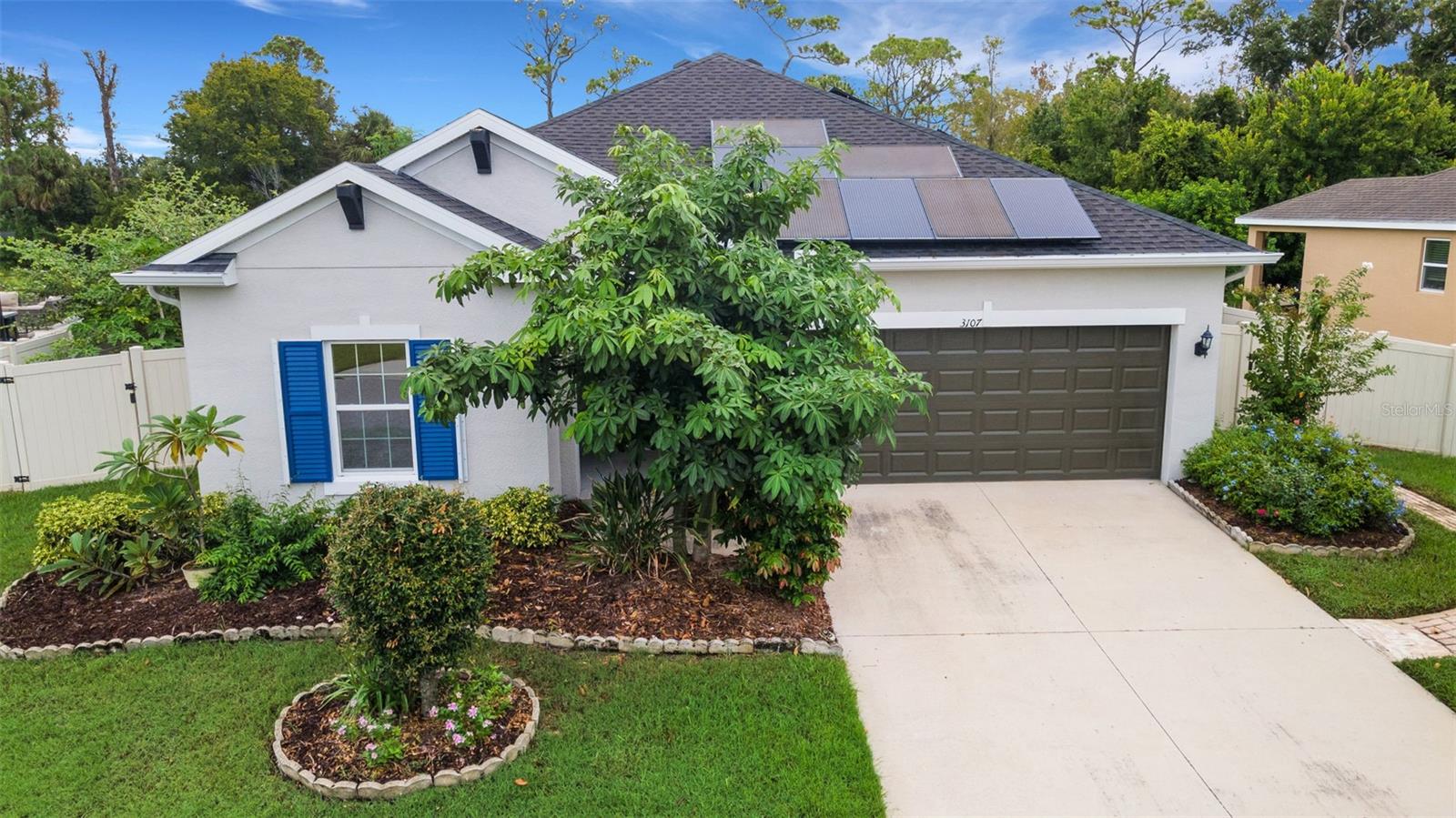 One Owner Immaculate 3BR/2BA single-family home in the desirable gated community of Holiday, FL. This move-in ready property features an open floor plan with tile flooring, modern cabinetry, granite countertops, and updated Samsung appliances. The spacious primary suite includes an ensuite bath and walk-in closet. Energy-efficient upgrades include a paid-for solar panel system with EV charging station and inverter for backup power, water softener, hurricane shutters, and rain gutters. Enjoy a private fenced backyard with multiple fruit trees, an extensive water reclamation system, and a variety of immune-boosting plants perfect for any green thumb. Very motivated seller reflected in our competitive list price! Low HOA fees. Conveniently located near Key Vista Nature Park, Anclote River Park, Tarpon Springs Sponge Docks, Gulf Coast beaches, shopping, dining, and easy access to US-19, Clearwater, Tampa, Tampa Bay, Tampa Zoo and St. Pete.