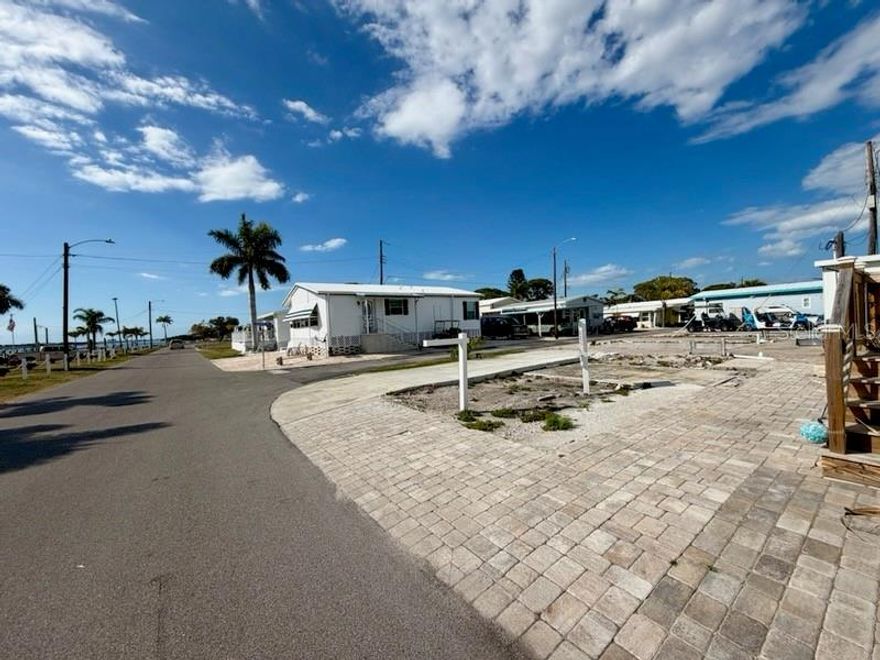 Nestled within the peaceful and vibrant Paradise Bay Estates, this vacant lot offers an unparalleled view of the serene Sarasota Bay, perfect for building your dream home. Located in an active +55 co-op park, this lot provides the ideal canvas for those looking to enjoy a relaxed, community-oriented lifestyle with prime access to the stunning waterfront.

You’ll be just a short 2-mile walk, bike, drive, or boat ride away from the picturesque beaches of Anna Maria Island, where you can soak up the sun, swim, or explore the island’s charming shops and restaurants.

The community itself is a haven for those seeking both tranquility and excitement. Enjoy a wealth of activities, from musical events and potluck dinners in the active clubhouse to leisurely afternoons at the water’s edge. The park also features several charming gazebos, perfect for watching breathtaking sunsets over the bay or sharing good times with friends.

For boating enthusiasts, there’s a community boat ramp and docks available, though the docks are currently on a waiting list. Kayaking excursions and golf outings are popular pastimes, offering a balance of adventure and relaxation right at your doorstep.

Whether you’re looking to build a peaceful retreat or a vibrant home surrounded by an engaged community, this lot offers an exceptional opportunity to live in a location that truly lives up to its name—Paradise Bay.

NOTE: this lot MUST be sold together with adjoining lot 4-4. Sellers will not separate. Buyer is responsible to do all due diligence to verify building codes and park guidelines. Agent can provide copy for mobile home design that could be built on these combined two parcels.