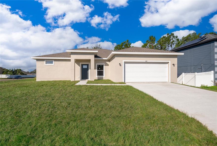 Must see corner lot newly-built 4 bedroom, 2 & 1/2 bathroom, 2 car garage ready to move in. The kitchen stands out with its quartz counters through out kitchen and bathrooms, modern cabinets. The built-in entertainment center, upgraded lighting, creating a perfect focal point in the home. The master suite boasts dual vanities with a quartz countertop, a modern rain and handheld shower, and lots of space. Perfect for unwinding after a long day! All common areas are tiled for easy cleaning, while bedrooms are carpeted to keep cozy. There's also a large covered lanai that would be perfect for summer gatherings with friends or family. As a bonus feature, this house also includes all-new GE appliances. Within 3 miles of shopping, hospitals, and schools. Call today to schedule an appointment! Hurry- this one won't last for long