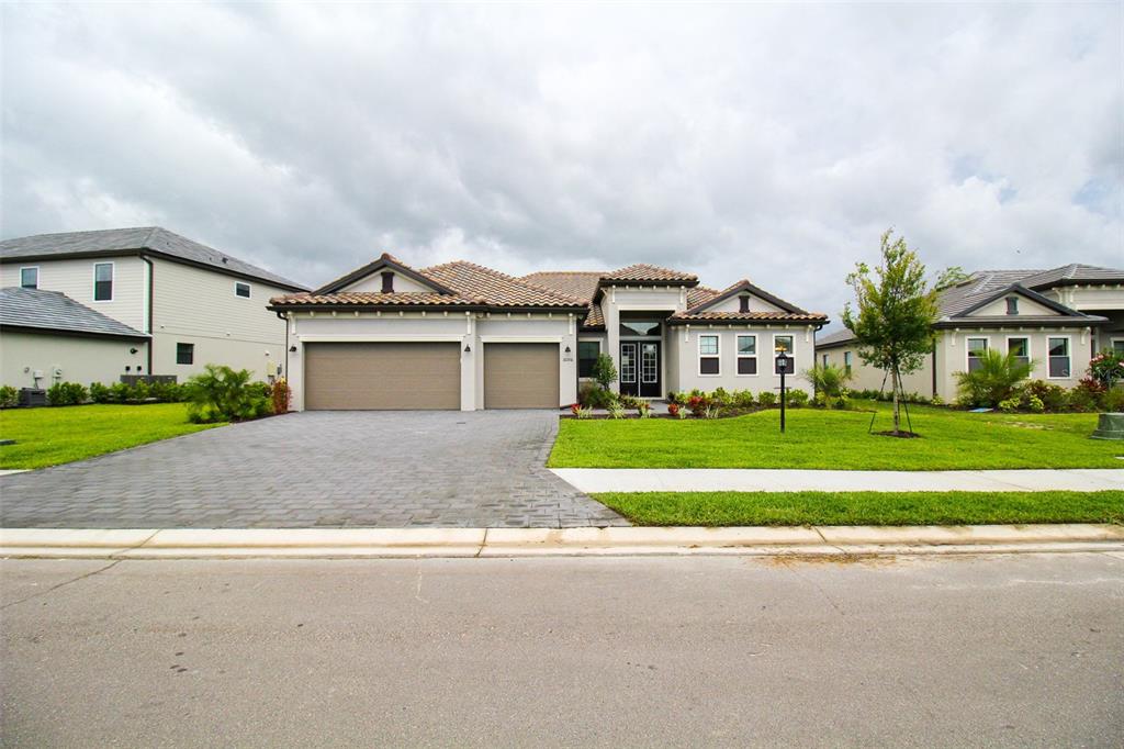 Welcome to Grand Getaway! This lakefront 3-bedroom, 3-bath, newly built private pool home has everything you need to make your vacation spectacular. This home is located in Lorraine Lakes, a newly developed gated community within Lakewood Ranch, Florida. Your adventures and boundless. Location is everything; this home is only a short distance from everyday conveniences such as shopping, restaurants, recreation centers, and the crystal-clear beaches Florida offers. Check out the surrounding resort-style Golf Courses! There are several in Lakewood Ranch; the most desirable to golfers is Esplanade, 4 minutes from the house, and River Strand, 14 minutes from the house! This estate home has a large paved driveway and pathway to the front door. Upon entering the house, you will find an open concept floor plan. The spacious living room has three plush couches for you to kick back and relax after a day by the pool, along with a Smart TV. You will find chic décor throughout this entire home. Adjacent is the office, where you can set up your remote office and have the perfect workcation. There is also a futon in the office. The chef’s kitchen has it all, fully stocked with a giant island with four barstools and all stainless-steel appliances. Adjacent is the dining room. This stunning table has views of the lake and can accommodate up to six comfortably. The primary bedroom is located off of the living room. This spacious room has a king-size bed, a Smart TV, and a set of sliding glass doors to the backyard with plenty of space for you to unwind after a day of adventure. The primary bathroom has a large walk-in closet, dual vanities, and an enormous walk-in shower with a detachable showerhead. The second bedroom has two twin-size beds with plenty of closet space for your personal belongings. The second bathroom has an updated vanity with a shower/tub combo. Down the hall is the third bedroom with a queen-size bed and a walk-in closet. Attached is the third bathroom with an updated vanity and a walk-in shower. The outdoor awaits! This stunning home has unobstructed views of the gorgeous lake. There is ample outdoor seating, a couch and chairs, a high-top table, Adirondack chairs, and plenty of chaise lounges. Enjoy the day swimming in the large rectangular pool, take a dip in the spa at night, and enjoy the pure tranquility this home offers. House Rule: No smoking. No burning candles inside of lodging. No parties. No Pets. Pool heating is optional, for an additional non-refundable fee of $25 per day + taxes to be paid directly to the management company after the reservation is confirmed. The Clubhouse and Amenities are being built and will be ready in early December 2022. There will be a Clubhouse with a state-of-the-art fitness center, aerobics studio, splash park, a large resort style community pool, a playground, a sports court, basketball court, tennis courts, volleyball courts and much more.
**Taxes and fees not included.