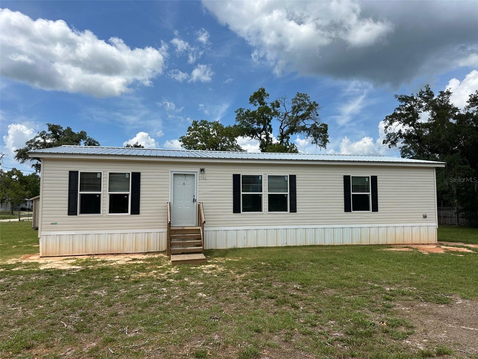 One or more photo(s) has been virtually staged. **OWNER MOTIVATED!! JUST REDUCED!!** This renovated 3-bedroom, 2-bath doublewide is the ideal mix of modern comfort and country living, situated on a spacious 0.57-acre fully fenced lot with no HOA and not in a flood zone. Whether you want a full-time home or a weekend retreat, this move-in ready property boasts over $68K in upgrades. Inside, you'll find a bright, open layout with luxury waterproof vinyl flooring, new stainless steel appliances, and a redesigned kitchen with custom cabinets and attractive countertops. Both bathrooms are fully updated, including a master bath with a garden tub and separate walk-in shower. All bedrooms feature walk-in closets, and the split floor plan offers privacy. An indoor laundry room adds convenience. Key upgrades include a new roof, HVAC system, well, and all necessary permits and inspections for your peace of mind. Outside, there are two large storage sheds (one with power), plenty of space for your RV, boat, or trailer, and underground electric service. Located just minutes from the Homosassa River, Gulf access, and top-rated schools, you’re only 20 minutes from the beach and an hour from Tampa via the nearby Veterans Expressway. Owner financing is available with competitive rates and a 65% down payment—making this a unique opportunity. Don’t miss out on the chance to experience Old Florida living—schedule your showing today! This home has appraised for much higher than the listing price.