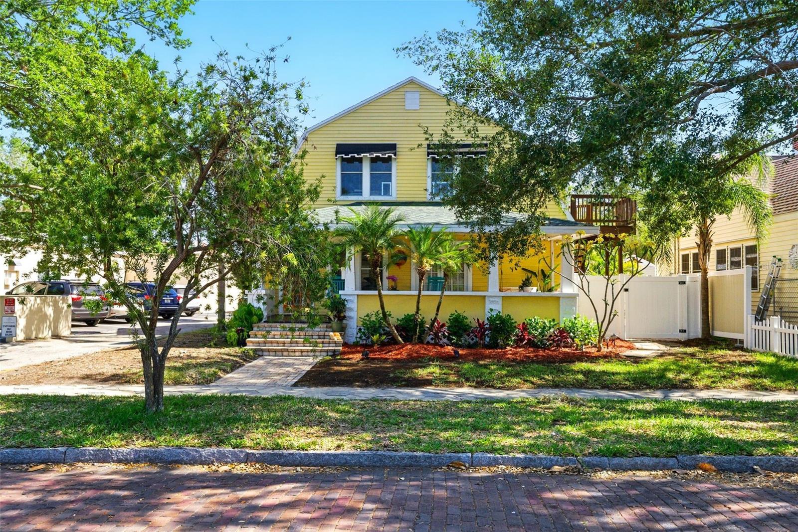 ** Massive Price Drop!! Sellers are Motivated ** At 920 16th Ave N, you don't have to imagine what living in paradise AND having your mortgage paid (by not one, but TWO INCOME PRODUCING UNITS) would be like, you get to LIVE IT! Located in Flood Zone X - NON-FLOOD ZONE and approx. 50 ft elevation according to multiple online data sources - Nestled in the gorgeous brick-paved neighborhood of Euclid-St. Paul, just minutes from Crescent Lake Park and the vibrant St. Pete scene, this property offers the Florida lifestyle you've always dreamed of. The primary 2-story home is an ENORMOUS 2374 sq ft living space consisting of 4 spacious bedrooms, 3 bathrooms, 2 living rooms, and a dedicated laundry room. Start your day with coffee on the GIANT front porch, where you will undoubtedly be greeted by friendly neighbors on their morning stroll. Grill out and chill out on either of your TWO the back decks in your fully fenced backyard where you will find plenty of gardening opportunities. Behind the main home, you will find the massive two story rental property which consists of two approx. 450 sq ft 1/1 rental properties on the second floor and 2 approx. 450 sq ft temperature controlled bonus spaces/storage rooms on the first floor, plus a laundry room which is shared by the two tenants. This fantastic property is SELF SUFFICIENT with access to well water in addition to city water and generator plug ins, and ENERGY EFFICIENT with fully installed solar panels providing significant savings. Whether you're looking to establish multigenerational living or wanting to house hack where your renters pay down your mortgage, this incredibly charming BIG YELLOW HOUSE is teeming with potential. Schedule your showing before it's gone!