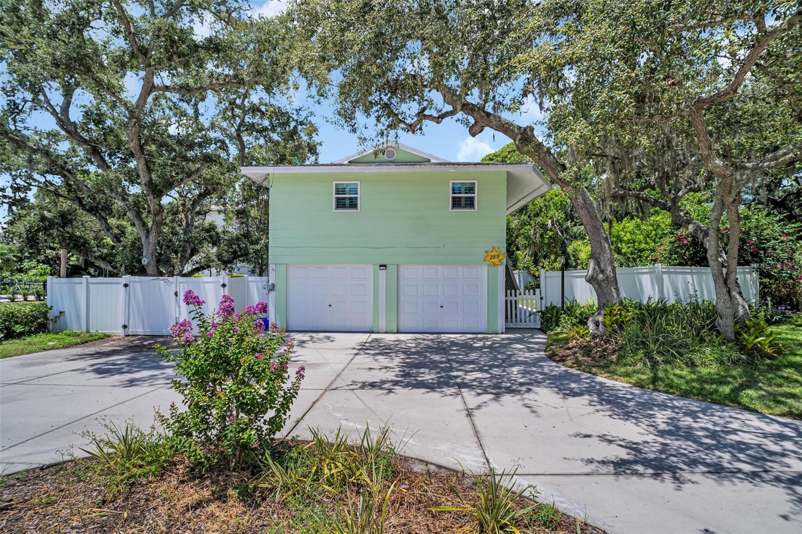 One or more photo(s) has been virtually staged. Welcome to your circular driveway leading to your stilted coastal cottage nestled in the heart of Palm Harbor's coveted Ozona Community. The 3 bedroom, 2 1/2 bath home with a bonus living space on the first floor is loaded with indoor and outdoor space. The home has plantation shutters and storm grade windows throughout. The kitchen provides newer appliances and an area to gather for family dining. A set of double sliding doors leads on to the oversized deck where friends and family can gather to enjoy the outdoors. The living room is located right off the kitchen and has an adjacent hallway that leads to the 3 bedrooms, a full Bathroom, and laundry nook. The primary bedroom has an ensuite bathroom for privacy. Bedroom two is generously sized and perfect for a bed and other furnishings. Bedroom three is more intimate in size, however it features an impressive larger closet. The laundry nook features a stackable washer and dryer convenient to all bedrooms.
Down on the first floor there is a bonus room that can be used as an office, den, craft room, guest room, or anything your heart desires. It is air conditioned with a mini-split unit to be used at your leisure. There is a large outdoor patio area that is screened in to keep bugs away while you enjoy the ample outdoor space.
The split garage is also on the first floor is sure to provide ample space for cars and a golf cart. With the half bath providing ample storage space. The fenced in yard is complete with a brand-new gate to complement the existing vinyl fencing. The gate is adjacent to the garage and perfect for boat and watercraft storage. The yard is ample and has plenty of space for outdoor enjoyment.
Location is EVERYTHING and Orange Street is home to several popular eateries, antique shops, and live entertainment just moments from your home. Bring your golf cart and head over to any one of the local marinas if boating is your thing. This coastal community is also proud of its top-rated schools, with the elementary school being within easy reach of your front door. Bring your bicycle, scooter, skates or running shoes, as the Pinellas trail is also nearby. Honeymoon Island is 3.4 miles away. Dunedin Causeway is 2 miles away. Downtown Palm Harbor is one mile away and reachable by golf cart. If Golf is your thing, the Innisbrook Country Club is 4 Miles away and home to the Valspar PGA annual tournament. Downtown Dunedin is 3.9 miles away. The Tarpon Springs Sponge Docks are 6.1 miles away. All information and measurements to be verified by the buyer and or buyer’s agent. PLEASE READ RELTOR ONLY REMARKS