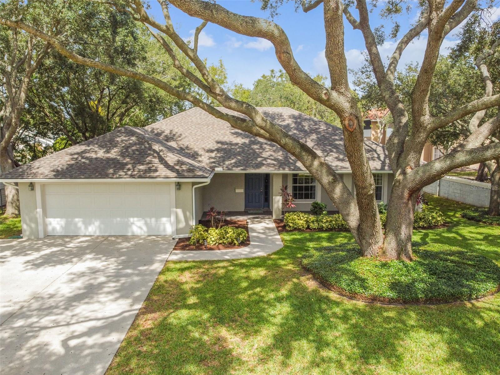 LOCATION, LOCATION, LOCATION! If you're looking to be in the heart of Clermont, this is home! Plus NO HOA!!! From the moment you pull into this incredible property, you're greeted with beautiful landscaping and mature trees. Enjoy seeing the sunsets on cool fall evenings from your oversized front porch - just in time for the trick or treaters! Once inside, you'll love the open concept layout with tall vaulted ceilings in this bright and airy home. Enjoy movie nights with friends & family around the spacious living room! The kitchen features solid oak cabinets with crown molding, stainless steel Frigidaire Gallery appliances, and tons of cabinet and counter space - perfect for prepping meals and entertaining. Grab coffee at the breakfast bar that's overlooking the dining room while appreciating the greenery through the window. The primary bedroom gets lots of natural light through the oversized window. The ensuite bath features a beautiful tiled shower with bench and large linen closet. On the other side of the home you'll find two secondary bedrooms and a shared hall bath. The second bedroom is like having two rooms in one! With two closets and windows too! The third bedroom is spacious and has a large window that floods the room with light. Enjoy time outdoors in the screened in porch or in the fully fenced back yard. And you can enjoy care free living with a new roof (2020) with gutters/leaf guards (2021), new AC (2021), upgraded electrical (2023), new water line (2023), and a whole house surge protector (2023)! But the best part of all is how centrally located this home is to the very heart of Clermont living! Here you're just minutes from waterfront park & downtown Clermont, Clermont Landing shopping center, and just a block away from grocery and shopping! You can't pick a better spot to be than right in the center of it all! Call today for your own private tour!