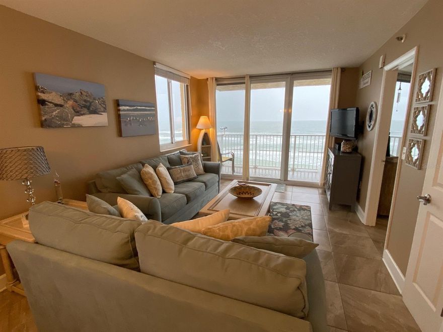 DIRECT OCEANFRONT PANORAMIC VIEWS WALK TO FLAGLER AVENUE DOWNTOWN Available NOW SUMMER RATES from 3 nights, weekly, monthly - Penthouse Paradise! Magnificent "Million-dollar" panoramic OCEAN views! Top Floor, two bedrooms, two full bath corner unit in a Direct Oceanfront in a Resort setting. Gorgeous north view to the Ponce de Leon Inlet Lighthouse and south view to Kennedy Space Center launches. Newly decorated & newly furnished. Unit is fully equipped, including beach chairs, umbrella and towels. All you need for your vacation...just bring a suitcase and toothbrush!  Enjoy breakfast or lunch at the oceanfront bar & grill restaurant right next door. Just a two-block walk to Flagler Avenue, which is the heart of activity on the beachside, with many gourmet restaurants, specialty shops, festivals and parades. Enjoy a Wine Walk every 4th Saturday!  Also, just two blocks to a public park with tennis courts and a basketball court. Amenities include two new elevators, beach with lifeguards, heated swimming pool, game room with pool table, large TV viewing room, business center and on-site parking for one vehicle.  Less than 30-minute drive to Daytona Beach attractions and less than 90 minutes to family attractions in Orlando, St. Augustine and Cape Canaveral, Non-Smoking, no pets. Request for Multiple Months long term rates. Additional fees: vehicle $10.00 nightly resort fee, Damage Insurance $99., Security Deposit refundable nothing missing or broken $1000 for monthly longer stays. Weekly Exit housekeeping fee: $250. On Stays of 6 months or less: additional cost is county & state tax of 12.5.