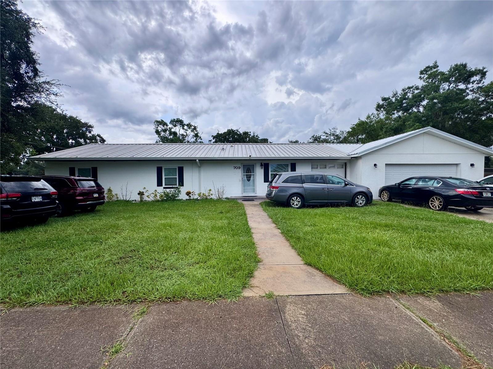 Welcome to 709 S Dillingham Ave in the heart of Kissimmee—a fully renovated .5 acre property offering a unique opportunity with a 3-bedroom, 2-bath main house and a separate 2-bedroom, 1-bath Accessory Dwelling Unit (ADU). Both units have been beautifully updated with modern finishes, including new flooring, contemporary kitchens, stylish bathrooms, sleek countertops, and brand-new appliances. The home features a durable metal roof and a fresh, modern aesthetic throughout. Perfect for large or multi-generational families, investors, or buyers looking to live in one unit and rent out the other. With no HOA and a prime location just minutes from Downtown Kissimmee, this property provides flexibility, convenience, and long-term value. Don’t miss this incredible opportunity to own move-in-ready homes on one lot in a growing, high-demand area.