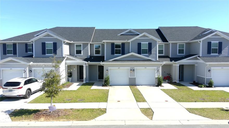 This beautifully upgraded townhome, located near Champons Gate, combines convenience and modern style. Featuring 3 spacious bedrooms, 2.5 baths, and stunning laminate flooring throughout, it offers both comfort and elegance. The remodeled bathrooms are sleek, and the kitchen showcases luxurious quartz countertops, 36-inch upper cabinets, and stainless-steel Samsung appliances. A spacious one-car garage and a convenient powder room on the first floor add to the home's functionality. Upstairs, enjoy a dedicated laundry area and a primary suite with a dual-sink vanity and spacious closet. With ample storage and high-end finishes, this townhome offers the perfect blend of modern living in a prime location. Please note, closing timelines may be longer than initially expected.