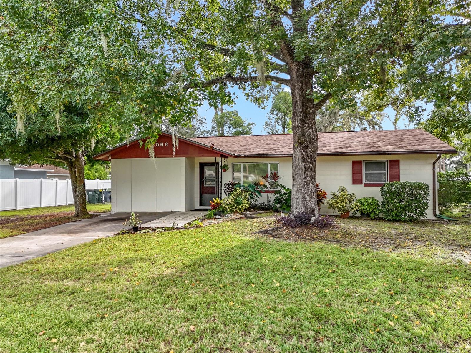 Check out this charming mid century single family home in the heart of Umatilla! This home features 3 bedrooms and two bathrooms on an oversized double lot, just off US 19 in Umatilla. The home features terrazzo floors, a split floor plan with a spacious primary bedroom, a rear covered patio spanning the length of the home for shade to enjoy the huge fenced back yard, car port, 2 sheds, and more! The home has been lovingly cared for, roof is 5 years old, AC is brand new with UV filter. Come see this one today!
