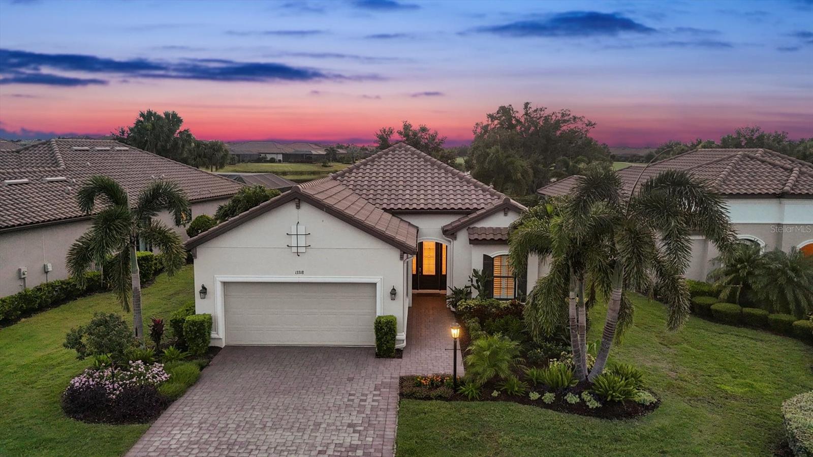 Experience the ultimate of luxury living with this highly sought after Lazio model, the most popular floor plan, and one of the Best Views in The Esplanade Golf and Country Club. This golf deeded home includes a golf membership, with no initiation fee, and pre-paid CDD fees by the seller, which is a rare and valuable bonus! A beautifully upgraded 3-bedroom, 3-bath home, also features a dedicated office, an extended tandem garage with space for two cars plus a golf cart and has epoxy floors and custom overhead storage, and has a light and bright open-concept layout, perfect for both entertaining and everyday living. The Gorgeous kitchen is the heart of the home with Cambria countertops, double wall convection oven/microwave, gas cooktop and hood, stainless appliances, pantry, and a huge center island. The split-bedroom floor plan offers privacy for guests and family, and features designer finishes throughout with exceptional attention to detail. The show stopper of this home is the stunning extended lanai with Panoramic screen enclosure to take in the beautiful sunset views of the lake, lighted fountain, and 9th hole tee box, while enjoying the salt water heated pool and spa, along with covered seating area and outdoor kitchen. More notable features and upgrades include: Motorized Kevlar Storm Smart hurricane screens for added protection, terrazzo pavers on lanai, outdoor and pool lighting, tankless hot water heater, Kinetico water filtration/softener, a main surge protector, Plantation shutters, 8 ft doors, custom ceiling finishes, custom closet shelving, plus additional custom storage in all bedrooms, laundry and pantry, ceiling speakers, upgraded lighting, New 10 yr battery life smart smoke and CO detectors, central vacuum system, along with being pre-wired for Synergy home security system. Enjoy Esplanade Golf and Country Club with its private 18-hole championship course, resort pool, tennis, Pickleball, bocce ball, a culinary center with multiple dining venues, state of the art fitness center, a full service spa and wellness center, dog park, playground, nature trails, and a full time social director coordinating the many events and activities. Located in a prime area close to the University Town Center, top-rated restaurants, shopping, I-75, Sarasota Airport, and a short drive to world famous beaches including Siesta Key and Lido Beach. This home is a perfect blend of luxury, comfort, and lifestyle, offered in one of Lakewood Ranch’s most exclusive communities. Schedule your private showing today, this one won’t last!