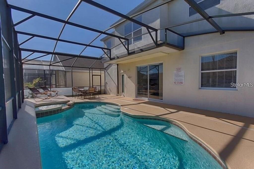 This spacious 6-bedroom, 3-bathroom home features a private pool and spa located within a gated community. The layout includes 2 bedrooms on the main floor and 4 bedrooms upstairs. It also boasts a formal dining room and a large great room with travertine tile flooring. The kitchen is equipped with stainless steel appliances and offers plenty of counter space.
You can relax or entertain in the screened-in lanai. Community amenities include tennis courts and two playgrounds. Rent covers lawn care, cable, and internet. Conveniently located just 15 minutes from Disney, this home is also close to Champions Gate golf, Reunion Resort, shopping, and restaurants.