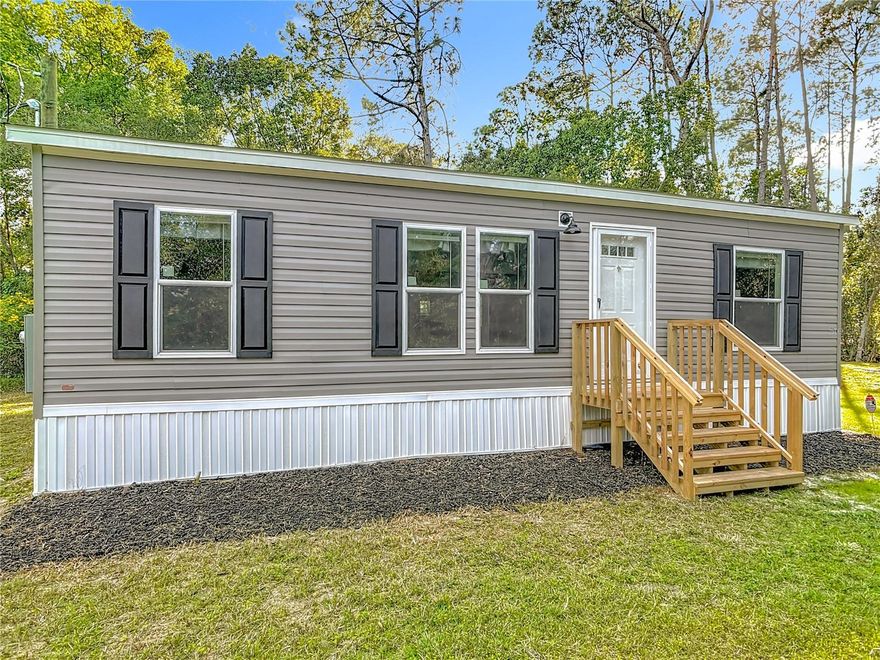 Welcome to 171 W Hagstrom Road in Pierson, FL. This brand new 2025 manufactured home offers 3 bedrooms and 2 bathrooms on a .38 acre lot and sits on a paved road. The open floor plan is perfect for everyday living. The primary bedroom is located on one side of the home, providing added privacy, and includes a walk-in closet and its own bathroom. The additional two bedrooms are located on the opposite side of the home. The property also has a nice line of trees that border the edge of the lot, giving additional privacy and a peaceful setting. Everything is brand new and installed in 2025: roof, HVAC, septic, plumbing, and electric.  It has public water with the Town of Pierson.  This home has never been lived in and is ready for its new owners to move right in and enjoy.