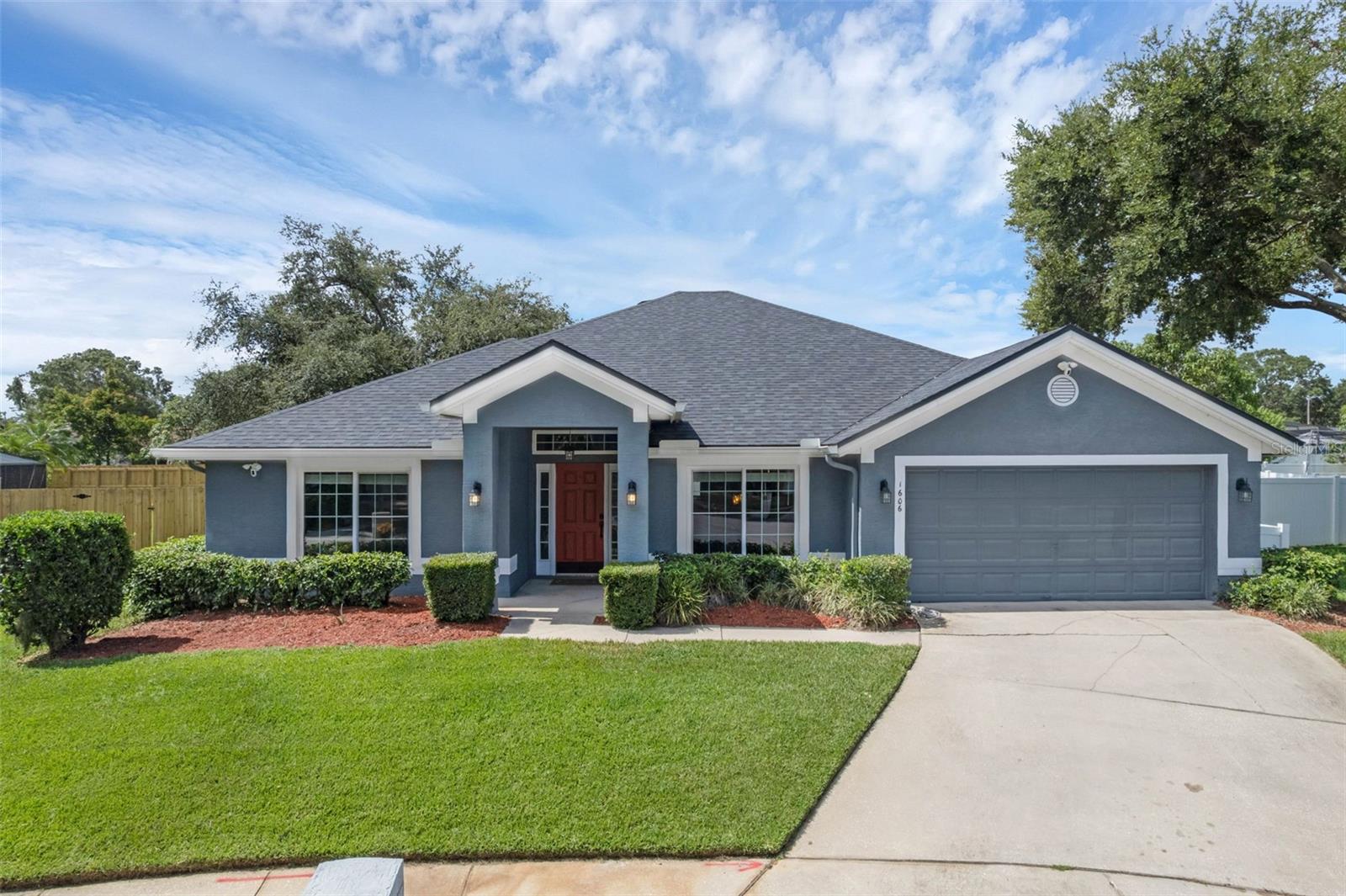 Nestled in a serene cul-de-sac in the heart of Winter Garden, Florida, this stunning 4-bedroom, 3-bathroom contemporary stucco home offers 2,455 square feet of comfort and style. Blending elegance and functionality, this residence has been meticulously updated with high-end features, making it an ideal choice for discerning buyers seeking a move-in-ready home. Step inside to discover a bright and airy floor plan, enhanced by new windows installed in 2020, rated for hurricanes up to 185 MPH, the home features a whole-house water filtration system with UV light for clean, purified water throughout. The open-concept living area flows seamlessly, offering ample space for gatherings and everyday living, a beautifully updated kitchen, featuring refinished cabinets (2020) and stainless steel appliances, including a new stove, microwave, and dishwasher, all installed in 2020. The exterior is stucco complemented by a new roof installed in 2020, ensuring durability. The front of the home is adorned with permanent trim lights, controllable via an app to change colors and patterns. The fenced backyard provides privacy, professionally designed 32 x 15 paver patio with a sitting wall and a retractable awning creates a shaded outdoor oasis. A large 10 x 12 permitted site-built shed offers ample storage or workshop space and the irrigation system keeps the lush landscaping vibrant and low-maintenance. this home is designed for effortless living. Located in vibrant Winter Garden, this home offers easy access to charming downtown shops, restaurants, golf car district and the scenic West Orange Trail.