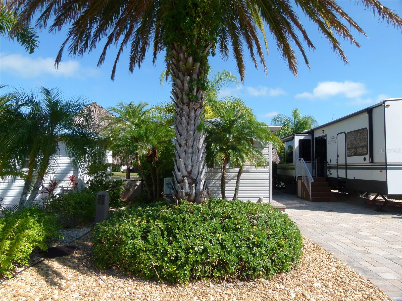 Silver Palms RV 5 Star Resort - Beautiful vacant lot with a Casita and a Tiki Hut. Wholly shed insulated and wired. Patio furniture staying, inside Casita is a Washer and dryer, with mini split, storage cabinet. Privacy area for sitting on the pond and enjoying the water and sunsets. Tiki comes with fan and lights. Stunning lot.