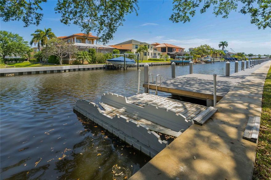 INCLUDES FREE BOAT DOCKING! - BOATING COMMUNITY with GULF ACCESS - where you can have your boat right out back for FREE! YES the boat docks are included in the monthly fees, (first come) so much more - like internet, cable TV, water, sewer, trash, common area taxes, master insurance policy including flood insurance, ground maintenance, waterfront heated-pool, exterior maintenance, paddleboard/kayak rack/launch, covered bike storage, clubhouse, a boardwalk along the docks and a gazebo for an afternoon picnic, how is this for worry-free living! Updated 3-bedroom, 2 bath condo located on the second floor. Your balcony (with storage closet) is located off the kitchen with water views where you can watch the dolphins and manatees swim by. Meticulously maintained second-floor condo with a COASTAL VIBE and enhanced with numerous upgrades including the kitchen wall removed to expand and open the space. Granite counters, tile backsplash, soft-close 42" wood cabinetry, stainless steel appliances, and recessed lighting. Electric panel replaced. New HVAC 4/2025 w a 10-year warranty on parts, 2-year on labor, new interior doors 2024, hurricane windows except the patio doors. No popcorn ceilings. Porcelain flooring throughout with 4" baseboards, Built in foyer bench with storage 2023, updated interior lighting, new balcony/railing and screen 2023. Ceiling fans in all bedrooms and all closets have lights. Full-size stackable washer and dryer. Close to shopping, dining, beaches, golf, and a hospital. Tarpon Springs has 2 beautiful beaches and several parks. There are many community events like First Friday, Saturday fresh markets, free concerts at the beach and wine walks.