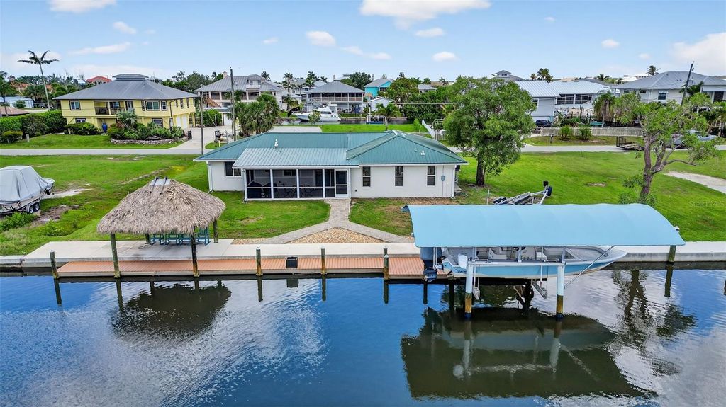 Photo of 24277 Treasure Island Boulevard, Punta Gorda, FL 33955 (MLS # O6315484)