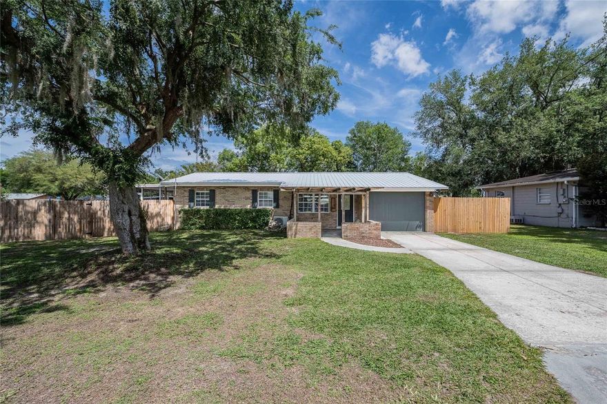 Welcome home to this charming, move-in-ready 4-bedroom, 1-bath residence situated on an oversized corner lot! This property features a newly resurfaced in-ground pool and a brand-new wood privacy fence, creating the perfect setting for relaxing or entertaining. Enjoy the spacious backyard from your 16' x 14' screened lanai overlooking the pool, ideal for year-round outdoor living. LED exterior lighting adds a beautiful touch for evening gatherings and enhances the home’s curb appeal. Inside, you’ll find a functional layout with generously sized rooms, ready for your personal touch. The home boasts new waterproof laminate wood flooring throughout, along with new ceiling fans and updated lighting. Additional upgrades include a newer energy-efficient hot water heater and a durable metal roof less than 10 years old.
Convenience continues with an indoor utility room featuring washer and dryer hookups. The property also includes a large shed with electricity—perfect for storage, a workshop, or hobby space.

This home offers comfort, space, and great potential—all in one inviting package!
