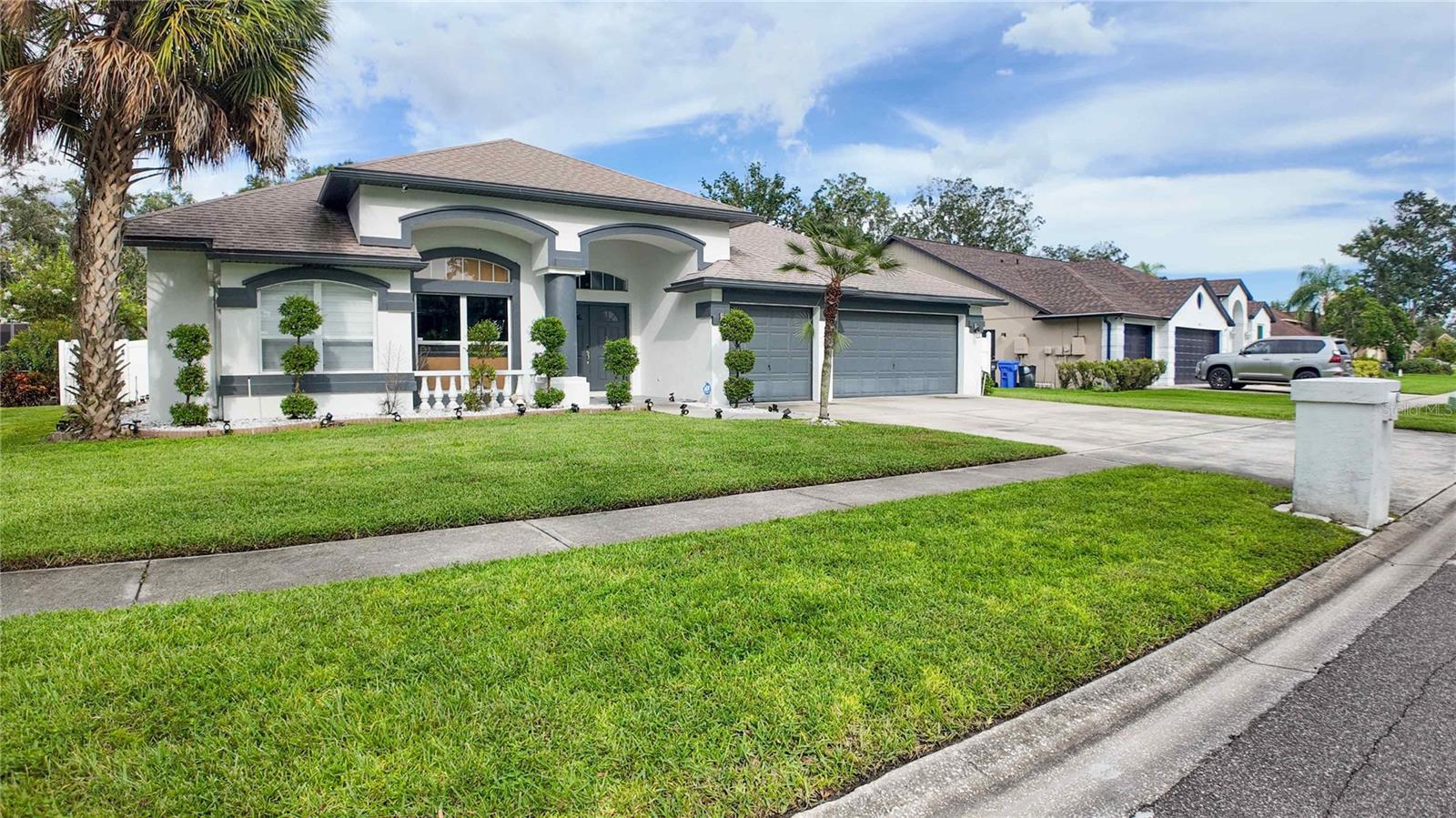 This one makes a splash! Pool home with a well-appointed yard! A special Valrico find, this 4-bedroom 3-bath Traditional home offers a treasure of lifestyle amenities. Tucked away on a pleasant street, the home is convenient to various shopping and dining destinations. The location is also convenient to schools (Alafia Elementary, Burns Middle & Bloomingdale High School).
The expansive, low-maintenance yard equipped with artificial turf is attractively landscaped and fenced in the rear. The welcoming front porch is open-air for maximum breeze flow, while the back porch is screened for privacy. Your outdoor furniture transforms the pavers patio into an extension of the home, ideal for socializing, or for relaxing after a dip in the pool. The centerpiece of the fully fenced backyard is a refreshing swimming pool. Of course there's a jacuzzi.
Equally appealing are the welcoming interior advantages of the home. Your inner stylist will find an expansive blank slate in the stylishly and naturally illuminated open floor plan. Sleek flat ceilings are easy to maintain. The wood burning fireplace gives the living room a welcoming feel, creating a great spot for reading or a nap (perhaps both in that order).
Opening seamlessly onto the living room, patio, and backyard, the large gourmet kitchen has been updated for luxury and convenience. Exceptional quartz countertops are in the classic island configuration, offering wraparound workspace. Beneath stylish lighting, this headquarters of fine eating is a stage that makes stars of chefs and midnight snackers. Culinary endeavors are powered by premium appliances.
The newly updated ensuite primary bedroom, conveniently located on the main-floor, is a great launch pad for the day. In addition to the convenience of the private bathroom, you will find ample closet space to let your wardrobe breathe. The other 3 bedrooms, unique and with plenty of closet space, also offer the convenience of ground floor accessibility. Well maintained and fully renovated home within the last two years- Roof 2014, HVAC system replaced in 2019, solar water heater, whole house water softener, reverse osmosis system at the kitchen sink, premium appliances and more. Low utilities cost and the solar water heater saving you money. You'll thank yourself for getting your offer in early.