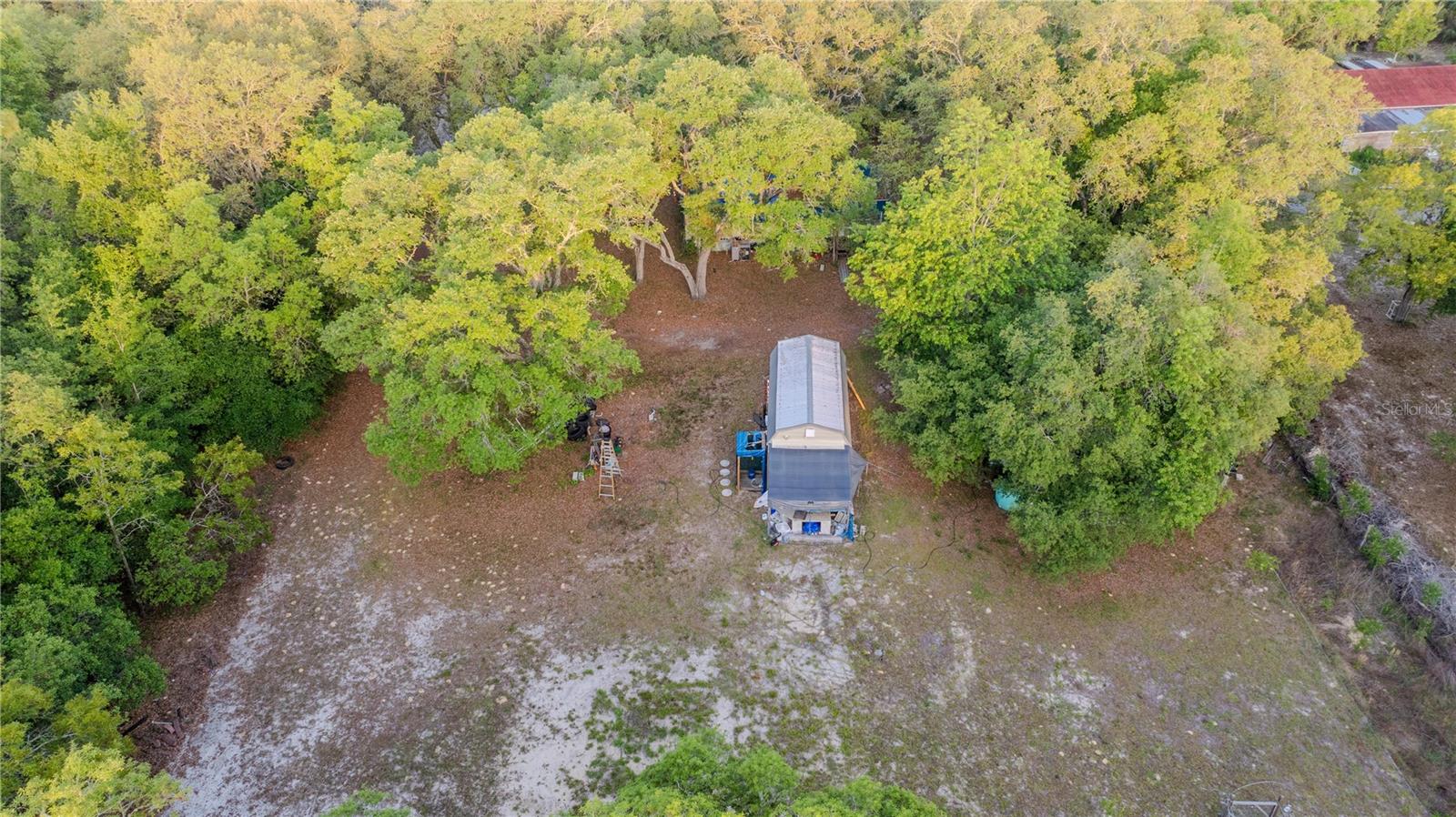 Wonderful location on a paved street, no HOA and A2 zoned. Well, septic and power are on. No impact fee. Nice level lot with one shed and fenced on two sides. Close to shopping and recreational activities. Great spot for a full-time home or as a winter retreat. The Rainbow River is a short drive and so is the town of Dunnellon. The manufactured home on site is in need of being removed.