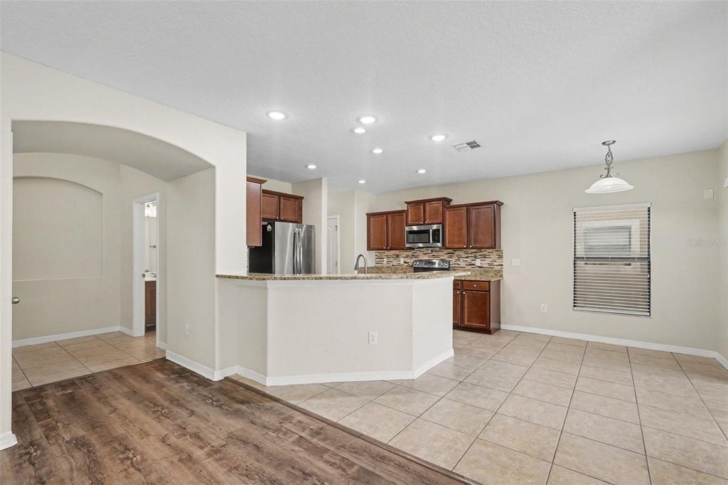 Photo of 10015 Newminster Loop, Ruskin, FL 33573 (MLS # O6452707)