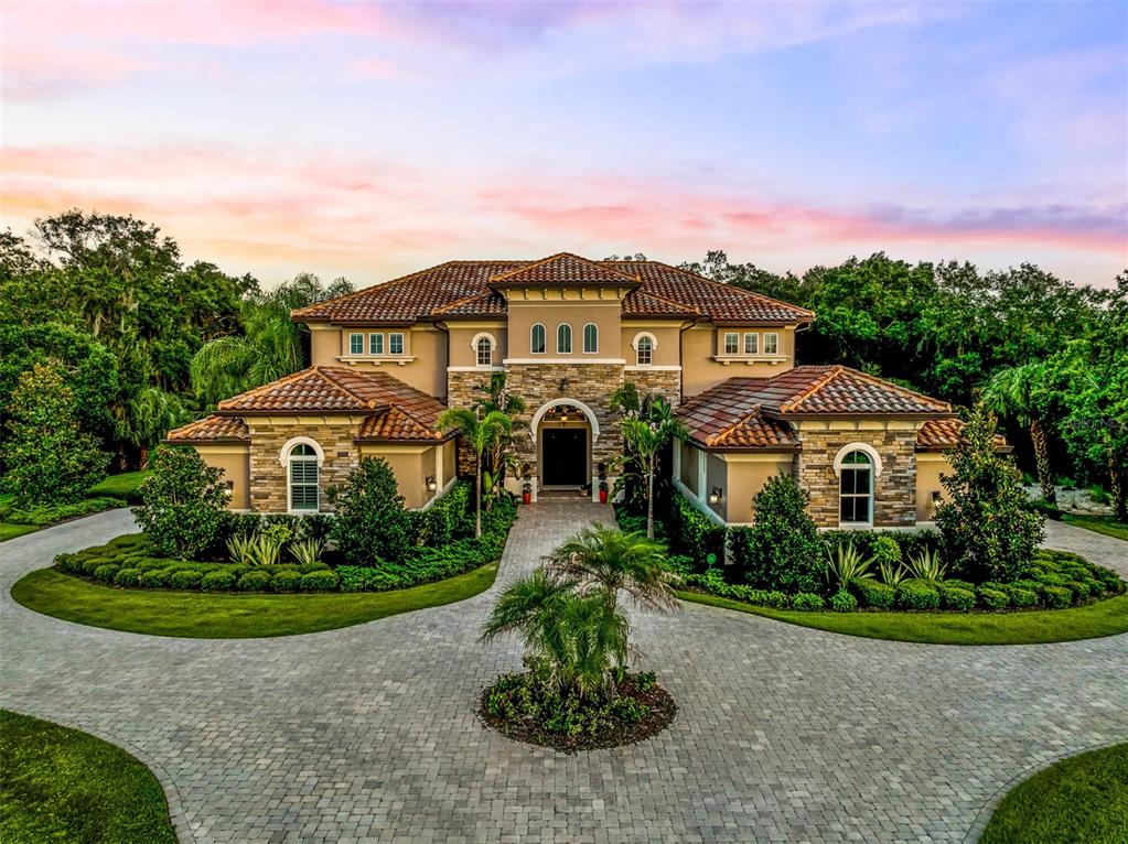 Estate and entertainment dream home in The Forest at the Hi Hat Ranch! 5,284 SqFt, 5 bedroom 6 and a half bath, including 4 ensuite bedrooms. 3D Matterport video in virtual tour. 4 car garage home built in 2016 on over 4 acres of land. Enormous caged heated pool and spa with summer kitchen, fireplace and multiple gathering areas for the best entertaining. Front foyer area with impressive 30ft ceilings. Stylish flooring throughout, unified with modern tile, wood and luxury vinyl floors. Grand living room with soaring custom tray ceilings with view to pool and lush backyard. Gorgeous kitchen with large cafe area and top of the line appliances including Thermador fridge/freezer, an ice maker, huge butler’s pantry, wine fridge and wine closet. Propane (buried) services for cooktop, fireplace and outdoor kitchen. Bonus family room upstairs includes kitchenette with dishwasher and accesses large second floor balcony for impressive views of property and caged pool. Newer built home includes whole house r/o system, outdoor cameras, landscaping lights and multiple HVAC systems zoned for efficiency. Many custom features including draperies, remote blinds, and plantation shutters. Many upgrades in lighting and ceiling fixtures. Connection for independent gas-powered generator. A MUST see! Easy and convenient to schedule a private viewing of this estate.