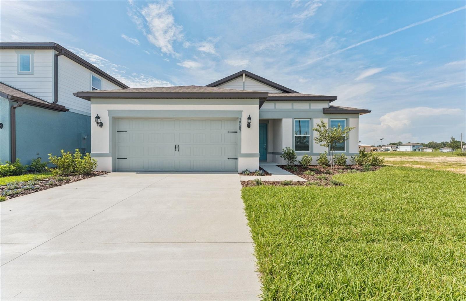 One or more photo(s) has been virtually staged. Move in Ready Available NOW!! Pulte Homes is Now Selling in Twisted Oaks! Enjoy all the benefits of a new construction home in the charming city of Wildwood, Florida, just 2 miles west of The Villages! This new home community will offer a resort-style pool with an open cabana, playground, green space, and dog park.
With an open-concept home design, this popular Medina floor plan has all the upgraded finishes you've been looking for. The gourmet kitchen showcases a spacious center island with a large single-bowl sink, white cabinets, 3cm quartz countertops with an 8”x9” white hexagon tiled backsplash, and Whirlpool stainless steel appliances including a dishwasher, range, microwave and refrigerator.
The bathrooms have matching white cabinets, quartz countertops, comfort-height commodes and dual sinks, a linen closet, a private commode, and a super walk-in shower in the Owner's bath. Luxury vinyl plank flooring is in the main living areas and flex room, 12” x 24” tile is in the baths and laundry room, and stain-resistant carpet is in the bedrooms.
This home makes great use of space with a versatile enclosed flex room, a convenient laundry room with washer and dryer and additional storage in the HVAC closet, an oversized gathering room, and a 2-car garage.
Additional upgrades include 4 LED downlights in the gathering room, pendant prewiring in the kitchen, upgraded door hardware, whole house faux wood blinds and a Smart Home technology package with a video doorbell.
Enjoy peace of mind with Pulte’s transferable, 10-year Limited Structural Warranty that covers materials and workmanship in the 1st year, workability of plumbing, electrical, HVAC, and other mechanical systems through the 2nd year, various types of water infiltration and internal leaks through the 5th year, and the structural integrity of the home through the 10th year. Plus, we’re currently offering limited-time incentives and below-market rates!