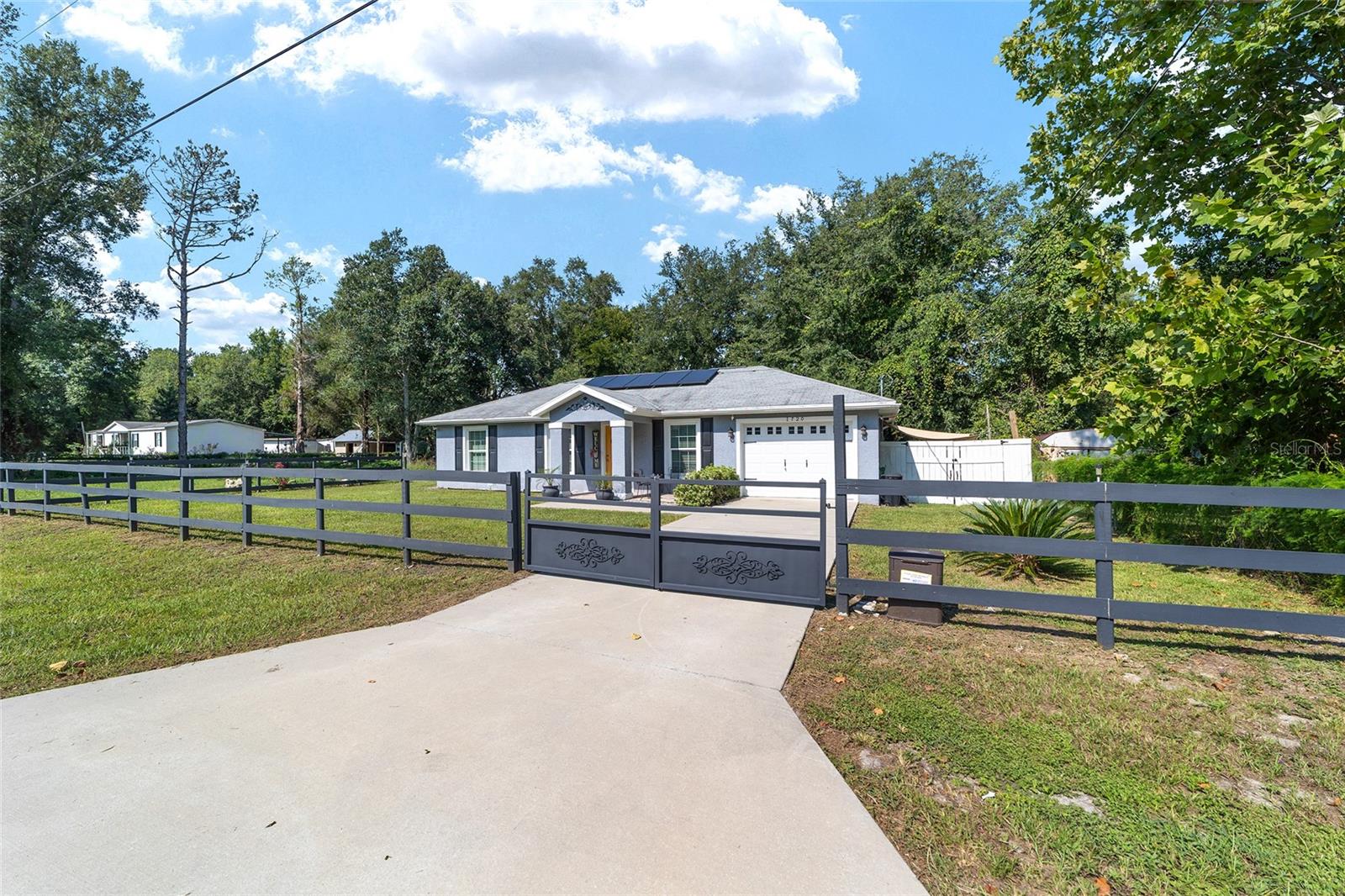 Better than new! Built in 2019 with upgrades including wood-style flooring, tiled garage & covered lanai. Energy efficient with premium insulation & paid solar system. Move-in ready, 3.5 miles to World Equestrian Center with excellent short-term rental potential. Quarter-acre fenced lot with option to buy adjoining lot for $25k. Quiet street, 3/4 mile to Hwy 40, 10 miles to Rainbow River, 23 miles to Florida’s Nature Coast & Gulf.