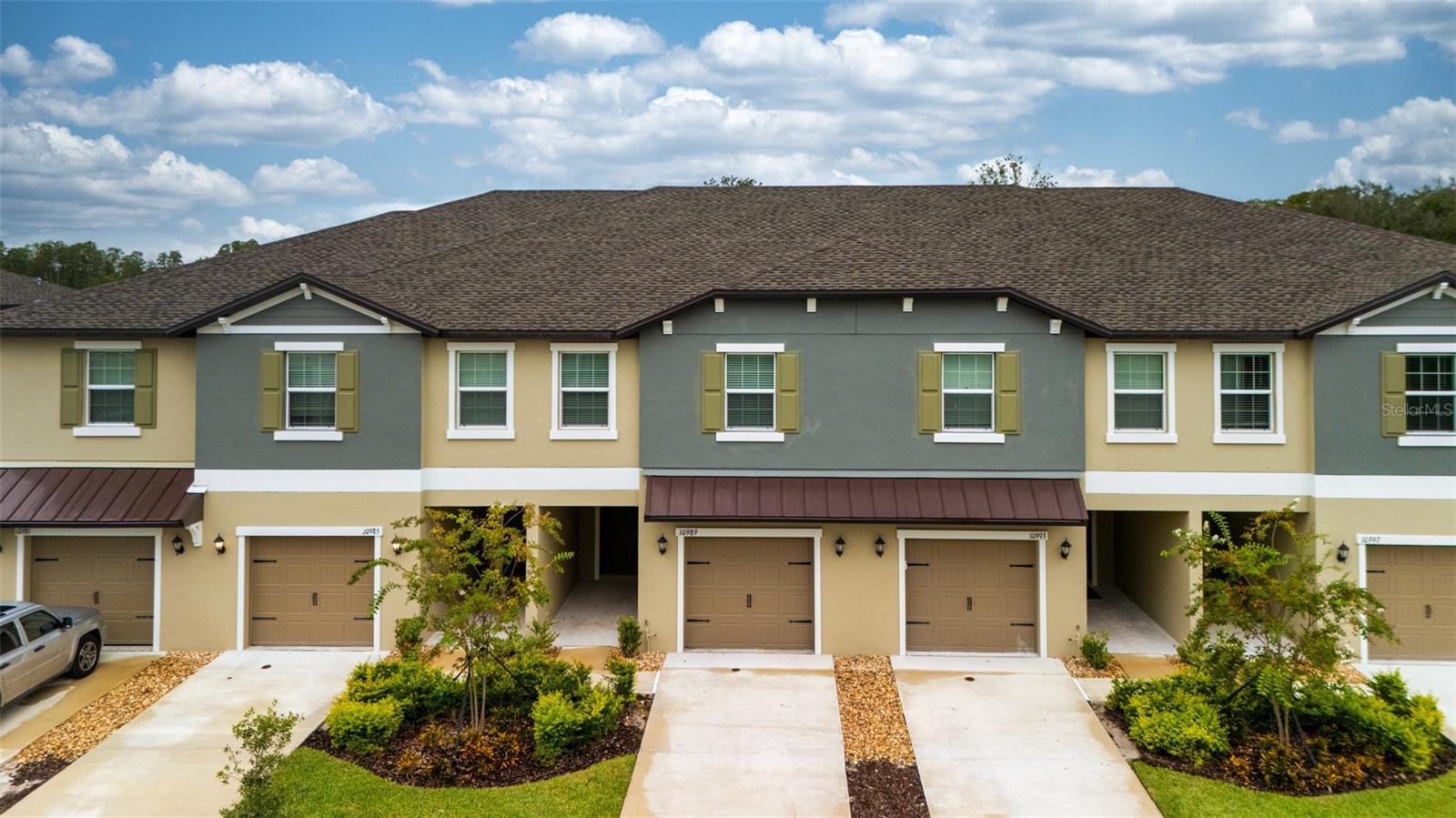 Beautiful 3-Bedroom Townhome in the Highly Sought-After Community of Angeline! Welcome to this stunning 3-bedroom, 2.5-bathroom townhome with a 1-car garage, perfectly situated in the brand-new master-planned community of Angeline in Land O’ Lakes, FL. Enjoy a peaceful pond view along with modern finishes throughout. Inside, the open-concept first floor features a contemporary kitchen with stainless steel appliances, spacious living and dining areas, and ceramic tile flooring. A covered patio extends your living space outdoors, ideal for relaxation or entertaining. Upstairs, you’ll find all bedrooms, including a private owner’s suite with an oversized walk-in closet, two secondary bedrooms with a full bathroom, plus a versatile loft area. The second-floor laundry with washer and dryer adds everyday convenience, while brand-new carpet gives a fresh, modern touch. Life at Angeline means endless opportunities for adventure and connection. Spanning over 6,200 acres, this community offers 3,600 acres of green space, up to 100 miles of scenic trails and pathways, a community farm, Lagoon, Pasco County park, and even a new STEM magnet school. Innovation also thrives here with Moffitt Cancer Center’s new 775-acre Speros FL campus. Don’t miss your chance to call Angeline home—schedule your private showing today!