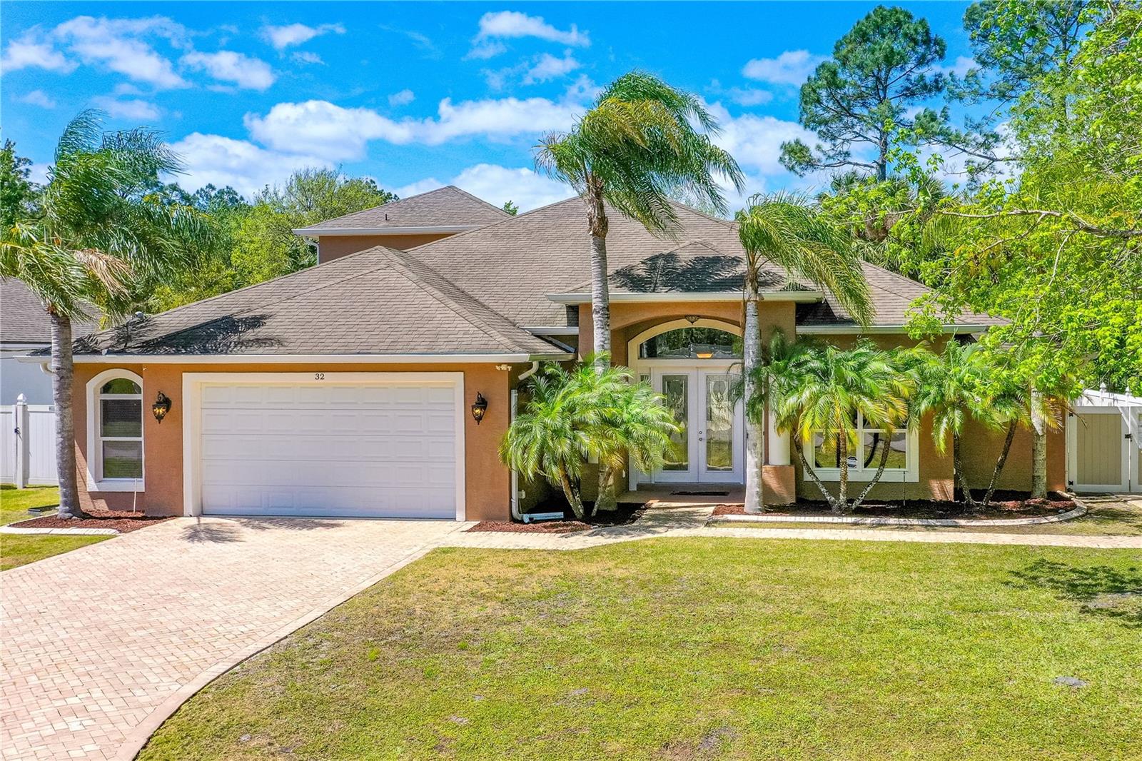 Spacious 4 bedroom 3 bath split floorplan home on large private lot. As you enter the home through the leaded glass French doors you are greeted by double tray ceilings and open floor plan showcasing a large family room, breakfast nook & formal dining room with double tray ceiling. The kitchen boasts beautiful wood cabinetry with 42'' uppers with crown molding, soft close drawers, pull out shelves for easy access to pots & pans, granite countertops, walk-in pantry, breakfast bar and built-in computer station. The exquisite master bedroom also has double tray ceiling & a massive updated bathroom, 2-walk-in closets with built-ins & lanai access. Two large bedrooms on the other side of the home along with a 2nd full bath with lanai access & inside laundry. Private en-suite upstairs complete with a full bath & balcony overlooking a large, fenced backyard. Relax on your large covered screened in lanai. Plenty of room for a pool. Oversized 655 sqft garage. Beautiful mature Palm tree Kitchen appliances do not convey. Master bedroom needs shower finished, a sink faucet & other minor finishes. Upstairs En-suite needs flooring & bathroom finished. All information recorded in the MLS is intended to be accurate but cannot be guaranteed.