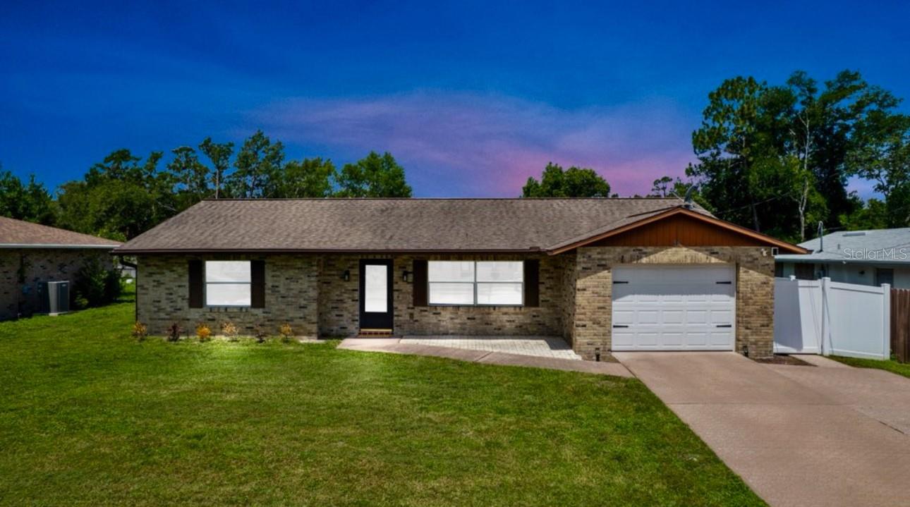 Beautifully Renovated Home with Modern Upgrades INCLUDING paid-off Solar Panels! Welcome to this meticulously maintained 2 bedroom, 2 bath and thoughtfully upgraded home featuring a renovated kitchen with quartz countertops, a custom pantry, and a versatile nook perfect for a home office! Enjoy updated bathrooms, an en-suite master bath, and easy-care laminate flooring throughout with tile in the baths. Newer appliances, washer and dryer. Major updates include a new water heater (2024), new drain field (2022), garage door + opener (2019), and a roof from 2016. Energy-efficient solar panels, window tinting, and EV charger wiring add modern sustainability and convenience. Relax in the screened-in back porch or enjoy the 10x20 concrete slab—ideal for outdoor living. A vinyl privacy fence surrounds the backyard, and the oversized one-car garage boasts storage rack systems for maximum organization. Additional highlights include ceiling fans throughout, HVAC regularly maintained, plus a 1-year home warranty included for peace of mind. Only the second-ever homeowners—this home is truly move-in ready! Conveniently located near schools, shopping, and the Sunrail for easy commuting. Schedule your private tour today! Property may be under audio/video surveillance.