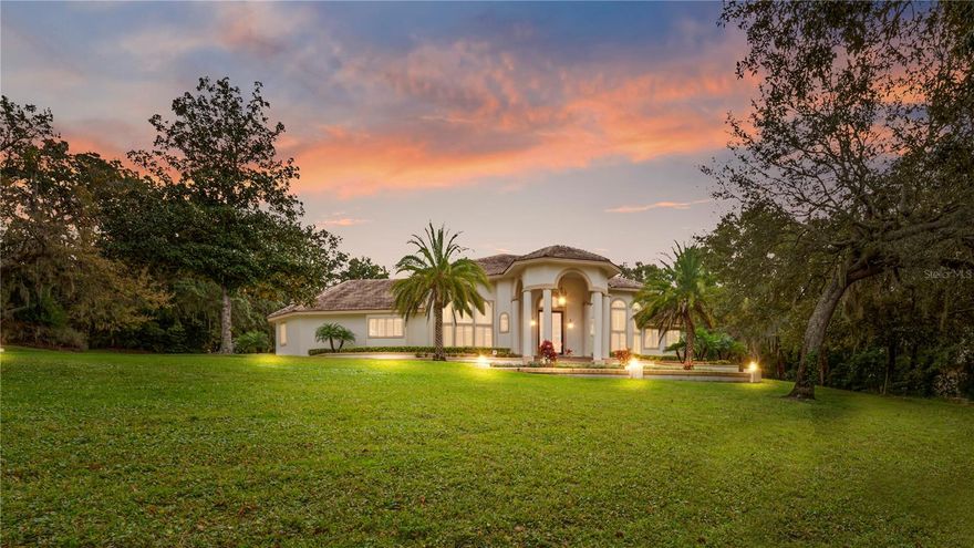 Welcome home to this exceptional executive estate located within the prestigious 24-hour manned, gated community of Sweetwater Club. Privately positioned on an elevated 1.27-acre corner lot, this remarkable residence features a 4-car garage, circular driveway, and commanding curb appeal.

Step through the oversized front door into a grand, open-concept interior designed for both luxury living and entertaining. The expansive main living area seamlessly connects the foyer, formal dining room, living room, sitting area, wet bar, and den, all overlooking a stunning courtyard-style pool, creating an ideal indoor-outdoor flow.

The chef’s kitchen is truly impressive, showcasing solid wood cabinetry, high-end granite countertops, pendant lighting, two dishwashers, double convection ovens, a spacious walk-in pantry, and new appliances including refrigerator, freezer, double oven, and built-in microwave.

The private south wing is dedicated to an extraordinary owner’s suite offering a fireplace, office or nursery, dual walk-in closets, and a spa-inspired bath complete with jetted tub, walk-in shower, and a fully equipped fitness room with direct access to the pool deck.

Upstairs, you’ll find three additional bedrooms, two beautifully appointed bathrooms, a large game room, and a breezeway with balcony access leading to the pool house / in-law suite, perfect for guests or multi-generational living.

Conveniently located just minutes from Wekiva Springs State Park, Sweetwater Golf & Country Club, shopping, dining, and everyday conveniences.

Furnishings available.
This is a rare opportunity to own a truly one-of-a-kind luxury retreat—schedule your private showing today.