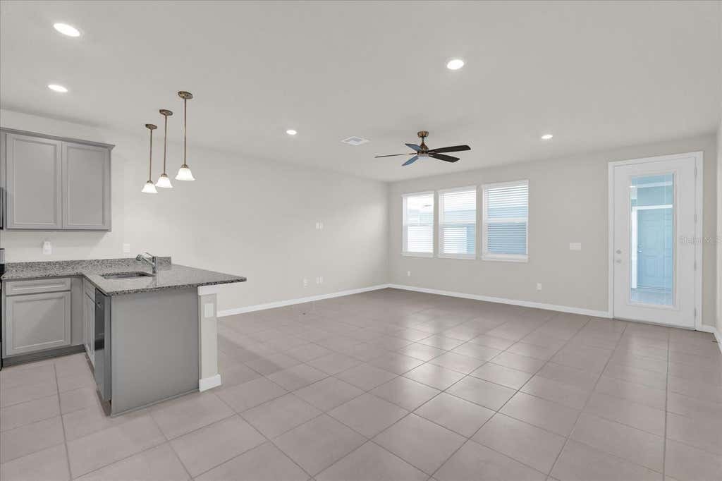Photo of 10877 Wooded Acre Alley, Orlando, FL 32829 (MLS # O6431808)