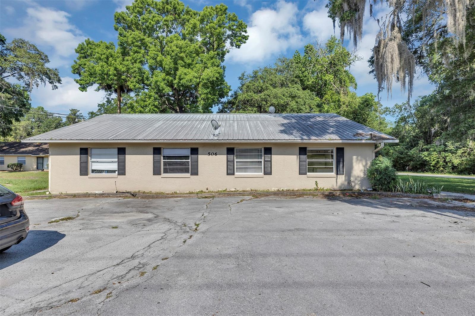 **No Deposit, Partial Deposit, or Full Deposit Options for renters are available — supported by Obligo
Welcome to Unit A at 506 NE 28th Avenue, nestled in a beautiful single-story quadplex set against the lush greenery of Northeast Ocala. This freshly updated unit offers peace, privacy, and convenience all in one.With neutral-toned stucco, classic shutters, and a durable metal roof, the building has a clean, low-maintenance appeal that complements the natural surroundings.The spacious parking area right in front of the building ensures easy access for residents and guests.Large front-facing windows bring in plenty of sunlight, making the interior bright and welcoming. The property is surrounded by generous yard space—Efficient wall-mounted AC keeps the space cool and comfortable.Transform your culinary space with this stunning kitchen featuring elegant white cabinets and sleek tile flooring. The bright, airy design not only enhances the aesthetic appeal but also creates a welcoming atmosphere for family gatherings and entertaining guests. The durable tile flooring ensures easy maintenance, while the spacious cabinetry offers ample storage for all your kitchen essentials.The granite countertops provide ample workspace.Appliances include a full-sized refrigerator, electric range,microwave oven with a deep dual basin sink and modern faucet completing the setup. A built-in breakfast bar adds additional counter space, perfect for casual dining or entertaining. The open layout flows seamlessly into a cozy dining or living space filled with natural light from large windows, offering a pleasant view of the front yard.The bedroom is generously sized and thoughtfully designed for everyday comfort. Large windows allow natural light to pour in, creating a bright and airy atmosphere. The room features ceiling fan for year-round comfort, neutral tones for easy decorating, and double-door closets for ample storage space. The bedroom offers direct access to the full bathroom, which has been updated with modern tile flooring and a clean white tub/shower combination.The property also offers off-street parking and a grassy front lawn.
Don’t miss your opportunity to own this beautiful home — schedule your showing today!
**Qualified renters can skip paying a traditional security deposit and instead use Obligo to secure the home. Standard screening criteria apply. Applicants not qualified for Obligo can still choose to pay a refundable security deposit.
*For your peace of mind, all communication regarding this property is handled exclusively by Leasing Florida Property Management. Please be aware of potential scams and avoid sending payments or personal information to unauthorized parties.Visit www.leasingfl.com