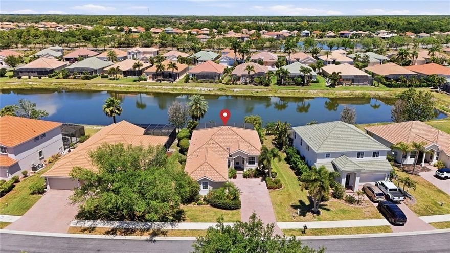 Welcome to Venice! Your poolside paradise, on a waterfront lot, within a gated community offering resort-style living is ready to make your own special oasis. This spacious residence features an open and inviting layout with tile flooring throughout the main living areas, abundant natural light, and seamless flow between the living, dining, and kitchen spaces—perfect for both everyday living and entertaining. A/C system has recently been replaced, to ensure a comfortable summer for years to come!

The kitchen is thoughtfully designed with ample cabinetry, expansive granite countertops, and a functional layout that opens to the main living area and breakfast nook. The primary suite offers dual vanities, a garden tub, separate shower, and a private water closet. Additional bedrooms provide flexibility for guests, family, or a home office.

Step outside to your screened-in lanai and private pool area, where even the hot tub comes with it, ideal for enjoying Florida lifestyles year-round with plenty of space for outdoor dining and relaxation. The pool comes heated, to enjoy all winter long, while looking across waterfront views!

Residents enjoy access to a wide range of amenities, including a resort-style pool, clubhouse, fitness center, tennis and pickleball courts, basketball courts, and sand volleyball. The community also features scenic walking paths, lush landscaping, and peaceful water views. This gated, deed-restricted neighborhood allows golf carts and includes maintenance of private roads, recreational facilities, and escrow reserves, providing both convenience and peace of mind. Make this Florida oasis your very own!