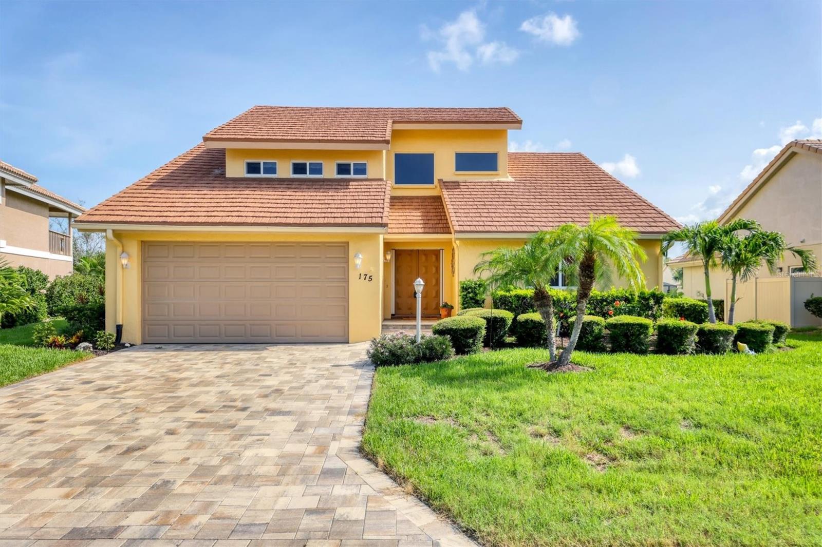 Waterfront paradise is just a short drive to Nokomis Beach! Welcome to this three-bedroom, three-bath home in the desirable gated community of The Inlets in Nokomis. On a saltwater canal with direct Gulf access, this lovingly maintained residence is a rare gem that combines the best of Florida coastal living with comfort and privacy. From the moment you enter, you'll be drawn in by soaring volume ceilings, a bright, open great room, and a wall of sliding glass doors framing tranquil views of your private dock and canal. The updated kitchen is a chef’s dream with wood cabinetry, granite counters, a large island, and a charming corner window offering serene water views. A huge walk-in pantry ensures ample storage space. The spacious primary suite features water views, high ceilings, and a luxurious en-suite bath with dual sinks, vanity, a large corner shower and an oversized walk-in closet. A generous second bedroom with adjacent bath is for guests, while the third bedroom occupies the second floor with its private bath, ideal for extended stays or a private home office. Whether sipping morning coffee on the screened lanai or enjoying sunset views as fish jump in the canal, every moment here is peaceful and picturesque. Lanai also has acrylic windows to create a four-season room! And, for peace of mind, owner installed impact windows in 2006, metal roof in 2006, and air conditioning and duct work were replaced in 2017. Community amenities include pickleball and tennis courts, a heated pool and spa, fitness center, bocce and more—all just around the corner from dining, shopping and vibrant charm of downtown Venice. Don't miss your chance to own a waterfront oasis in one of the best-kept secrets in Nokomis. Schedule your showing today!