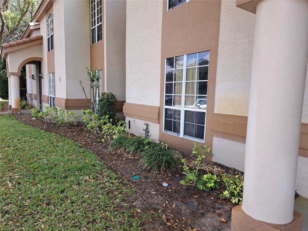 Photo of 4613 Gate Place #104, Orlando, FL 32811 (MLS # O6393567)