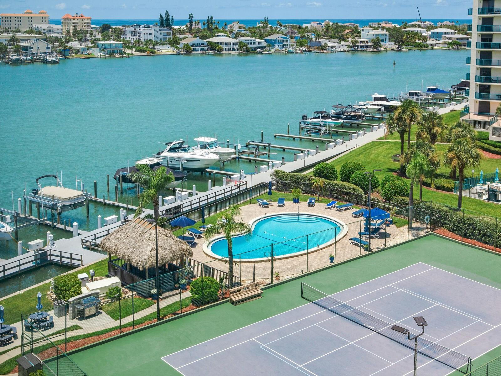 Live the Ultimate Florida Waterfront Lifestyle at Diamond Isle on Island Estates!
Welcome to your dream home in the sky, a fully renovated and exquisitely furnished 7th-floor waterfront condo in the highly desirable Diamond Isle community on Island Estates, Clearwater Beach. This spacious 2-bedroom, 2-bath residence offers 1,350 square feet of beautifully designed living space with panoramic water views of the Intracoastal Waterway and breathtaking seasonal sunsets over Clearwater Harbor.
Step into a light-filled open floor plan with floor-to-ceiling hurricane-rated windows and modern custom shades throughout. The redesigned open-concept kitchen features granite countertops, stainless steel appliances, wood cabinetry, a gorgeous tile backsplash, and a breakfast bar, perfect for entertaining. A bonus room off the kitchen adds flexible space ideal for a home office or den.
Both bedrooms are generously sized, offering tranquil water views and closet organizers, including a walk-in closet in the primary suite. Enjoy the convenience of an in-unit laundry closet, additional storage in the AC room, a new fire-rated entry door, new HVAC system, and water filtration system, all adding peace of mind and modern comfort. Also, enjoy the convenience of two designated storage rooms on the first floor.
MIRS and SIRS inspections have both been successfully completed, confirming the property’s excellent condition.
Resort-style amenities abound in this vibrant community:
• Heated waterfront pool
• Tiki hut with BBQ grills
• Tennis & Pickleball courts
• Fishing dock & kayak storage
• Sauna & locker rooms
• Fitness center & billiards room
• Game rooms with poker, shuffleboard, cornhole, puzzles, and more
• Library, meeting room, party room, and indoor shuffleboard
• Bike storage (regular & recumbent)
• Covered parking space and extra storage
Boaters rejoice — association-owned boat slips are available for just $190 per month (max size 35x11), with lift installations allowed at owner’s expense (availability must be confirmed with HOA).
This pet-friendly community (20 lb. max) allows leasing after one year of ownership, making it ideal for both full-time residents and seasonal snowbirds. Water, sewer, trash, basic cable, and Wi-Fi & flood insurance are all included in the monthly condo fee.
Ideally situated on Island Estates, a self-contained waterfront neighborhood with its own Publix, dining, banking, salons, and more, you’re just over a mile from the world-famous sugar sands of Clearwater Beach and the new amphitheater, The Sound. Hop on your bike or take the Jolly Trolley for easy access to everything Clearwater has to offer.
Whether you’re seeking a full-time home or a luxurious beach retreat, this move-in ready condo delivers the ultimate in elegant coastal living. Come live on the island — come live the waterfront lifestyle!